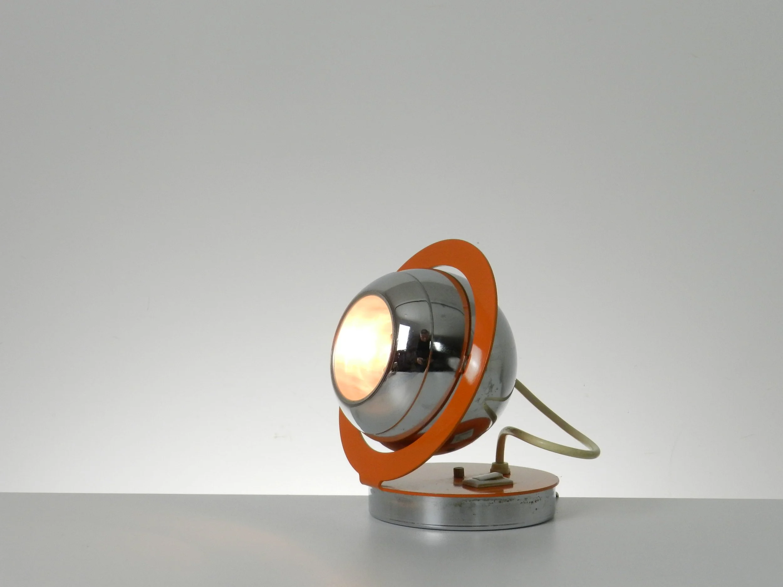 Space age eyeball lamp in enemeled metal and chrome.  Italy, 1970s.