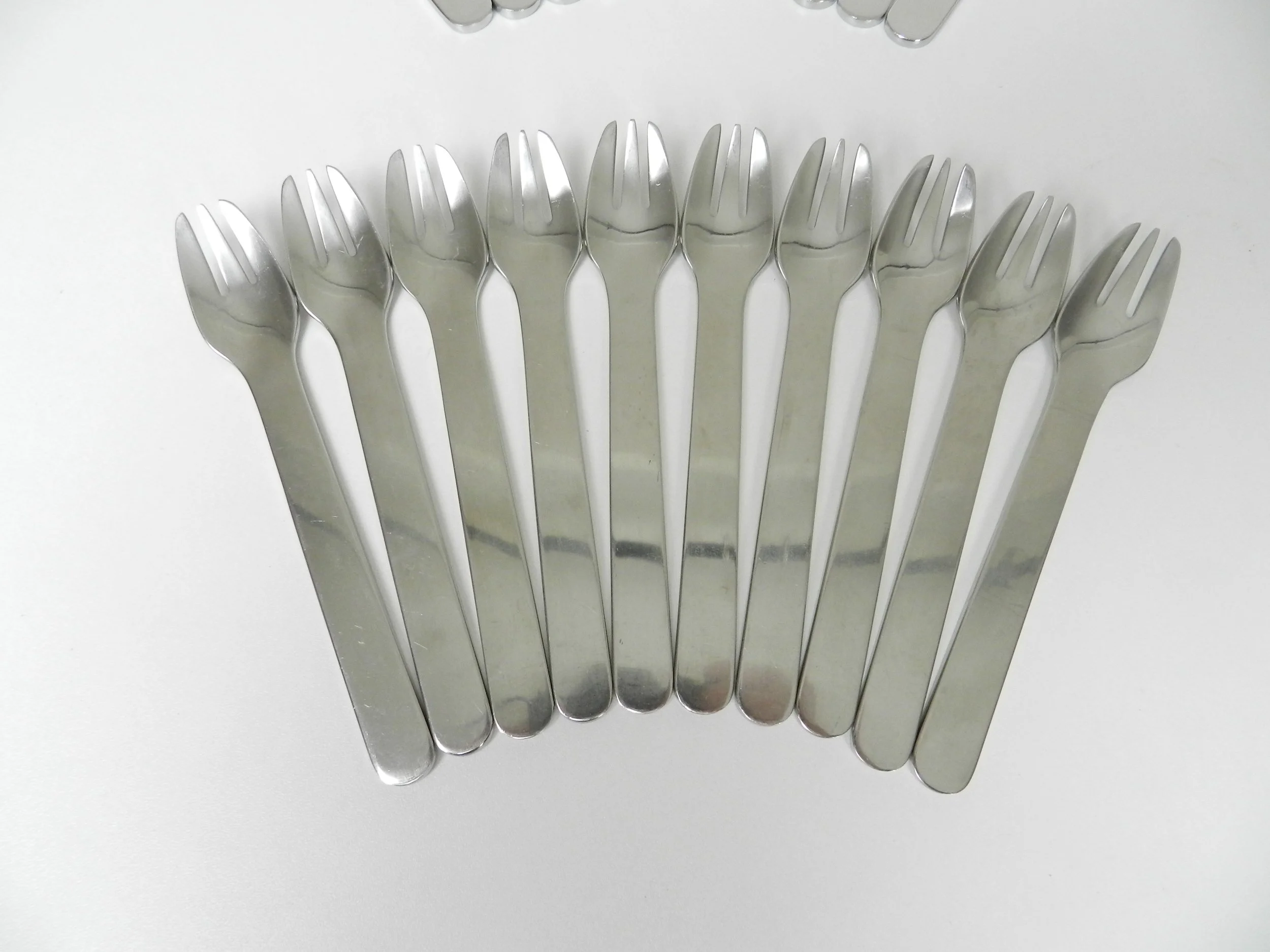 Stainless steel flatware designed by Louise Campbell for Georg Jensen, Denmark.