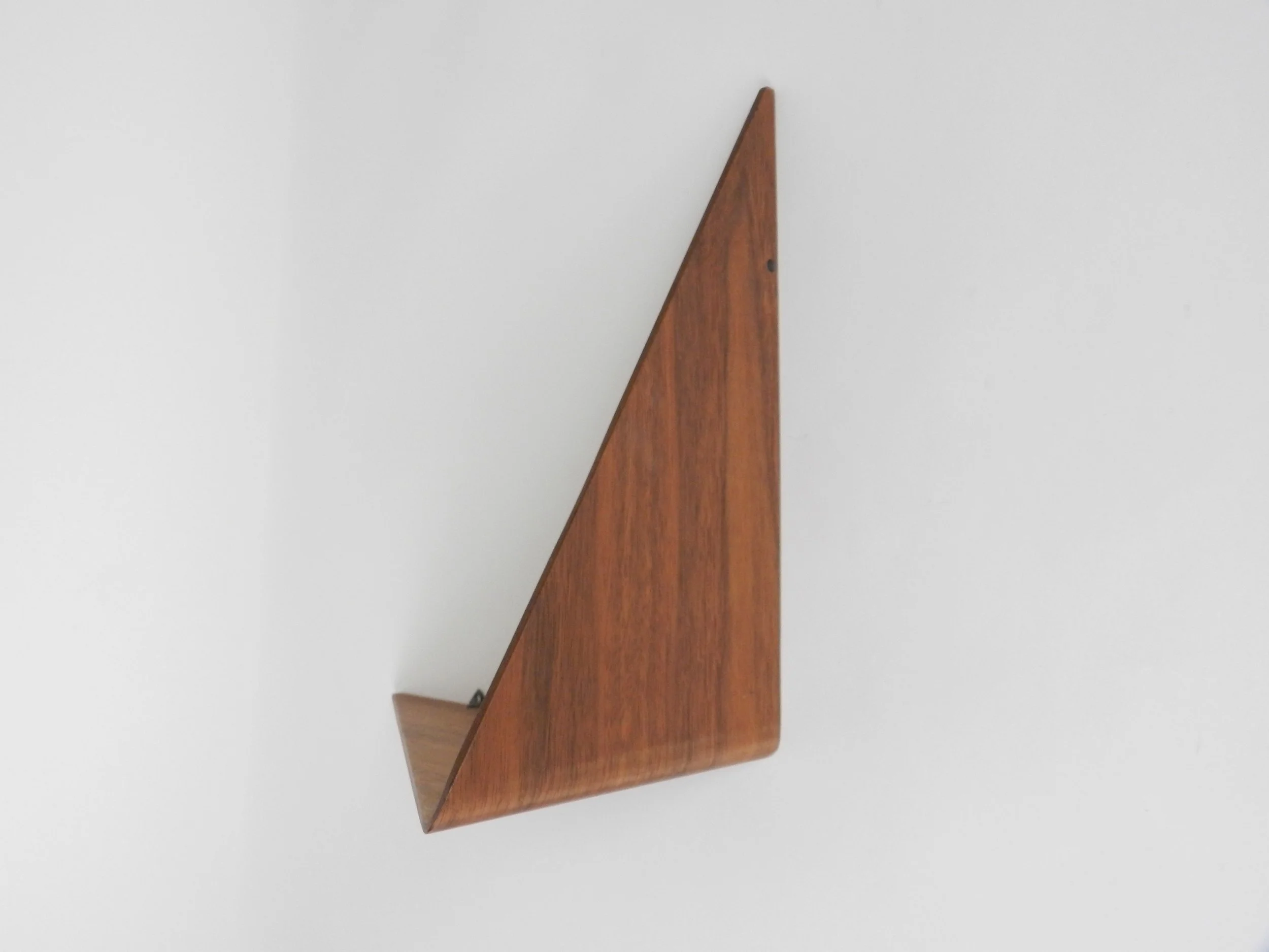 Wall shelf in bent plywood with teak veneer, designed by Poul Cadovius.  Denmark, 1960s.