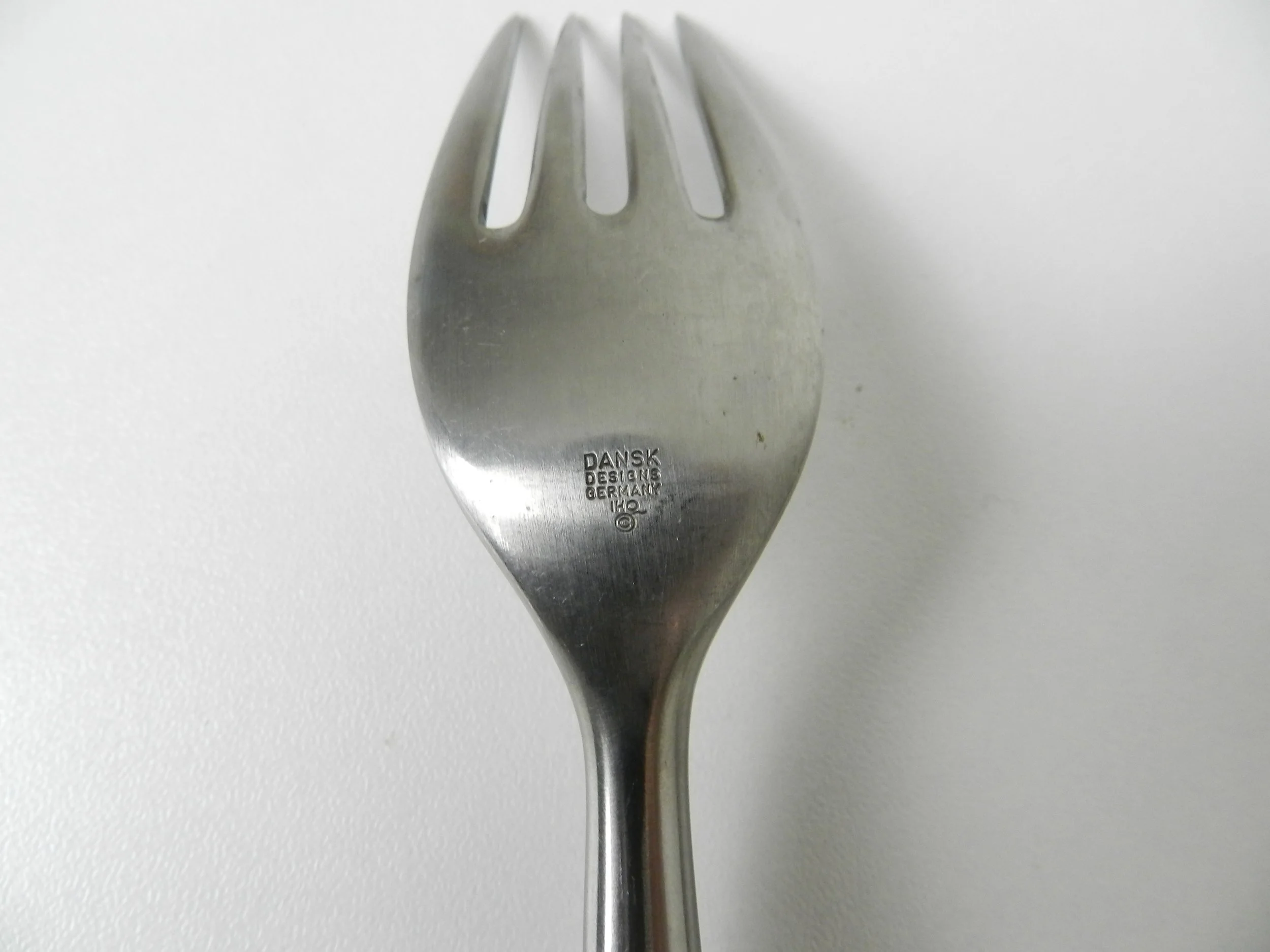 Stainless steel and teak Fjord flatware deigned by Jens Quistgaard for Dansk. Set includes 7 salad/desert forks, 1 dinner fork amd 1 soup spoon.  Germany, 1960s.
