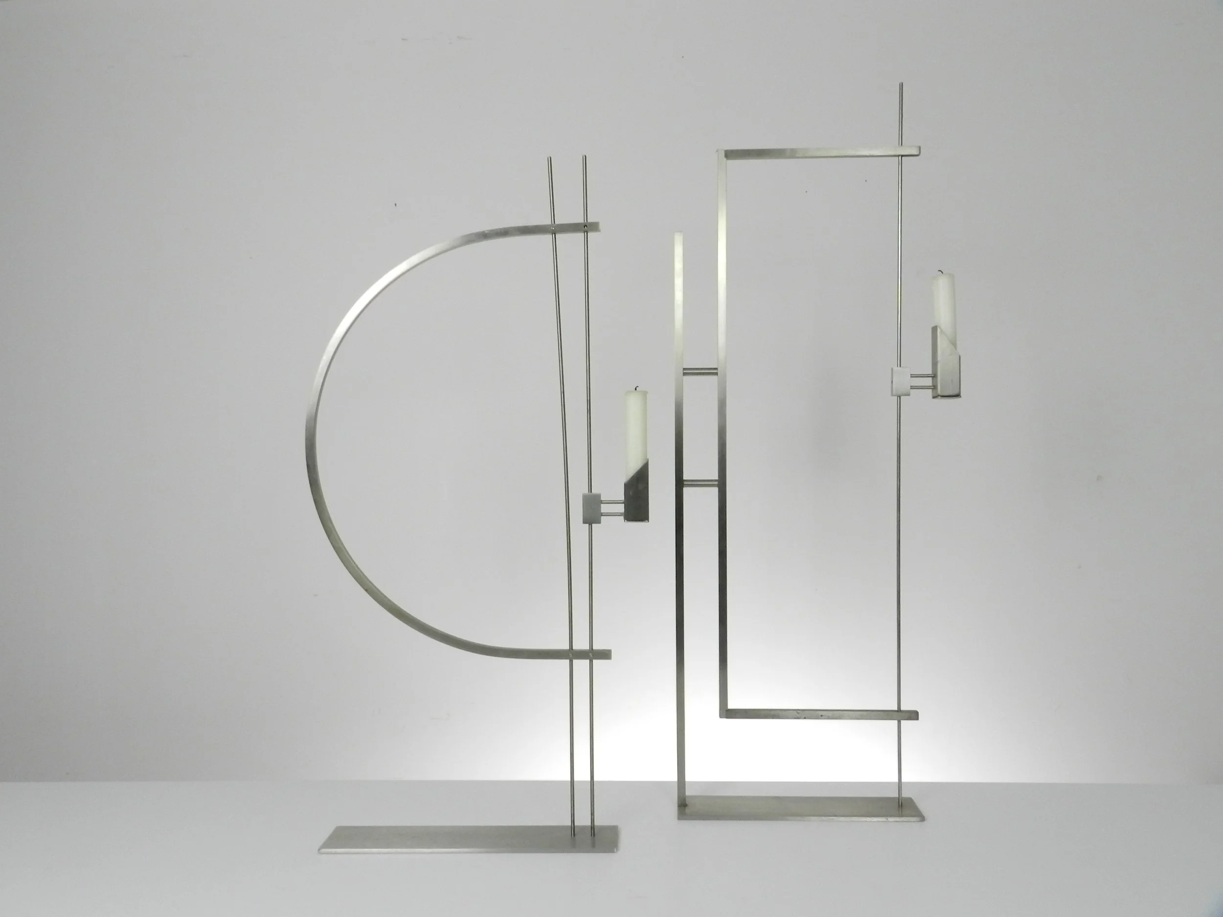 Pair of modernist stainless steel candle holders designed by David Zelman for Prologue 2000.  USA, 1980s.