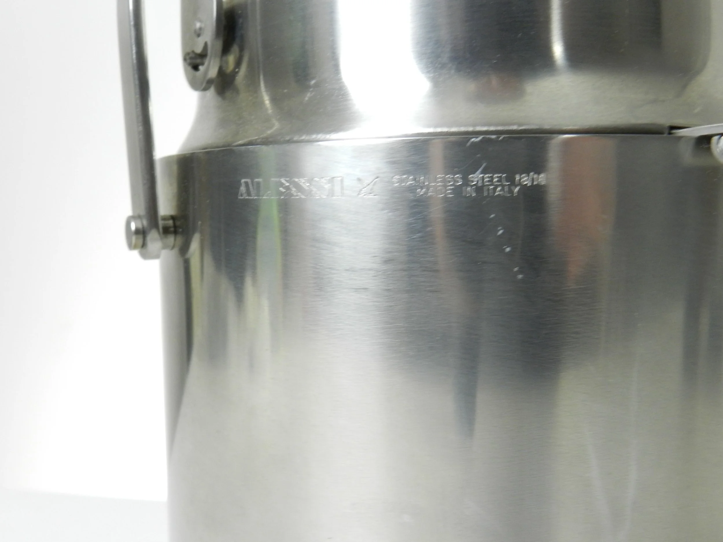 Stainless steel ice bucket with its mechanical lid, glass interior and plastic liner. Designed by Anselmo Vitale and Carlo Mazzeri for Alessi.  Italy, 1970s.