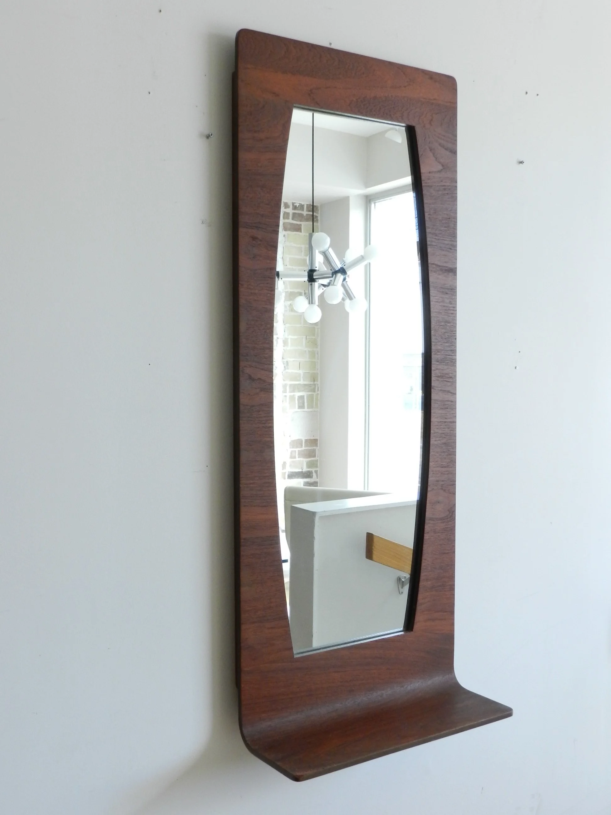 Bent plywood with teak veneer entry wall mirror with shelf.  Canada, 1960s.