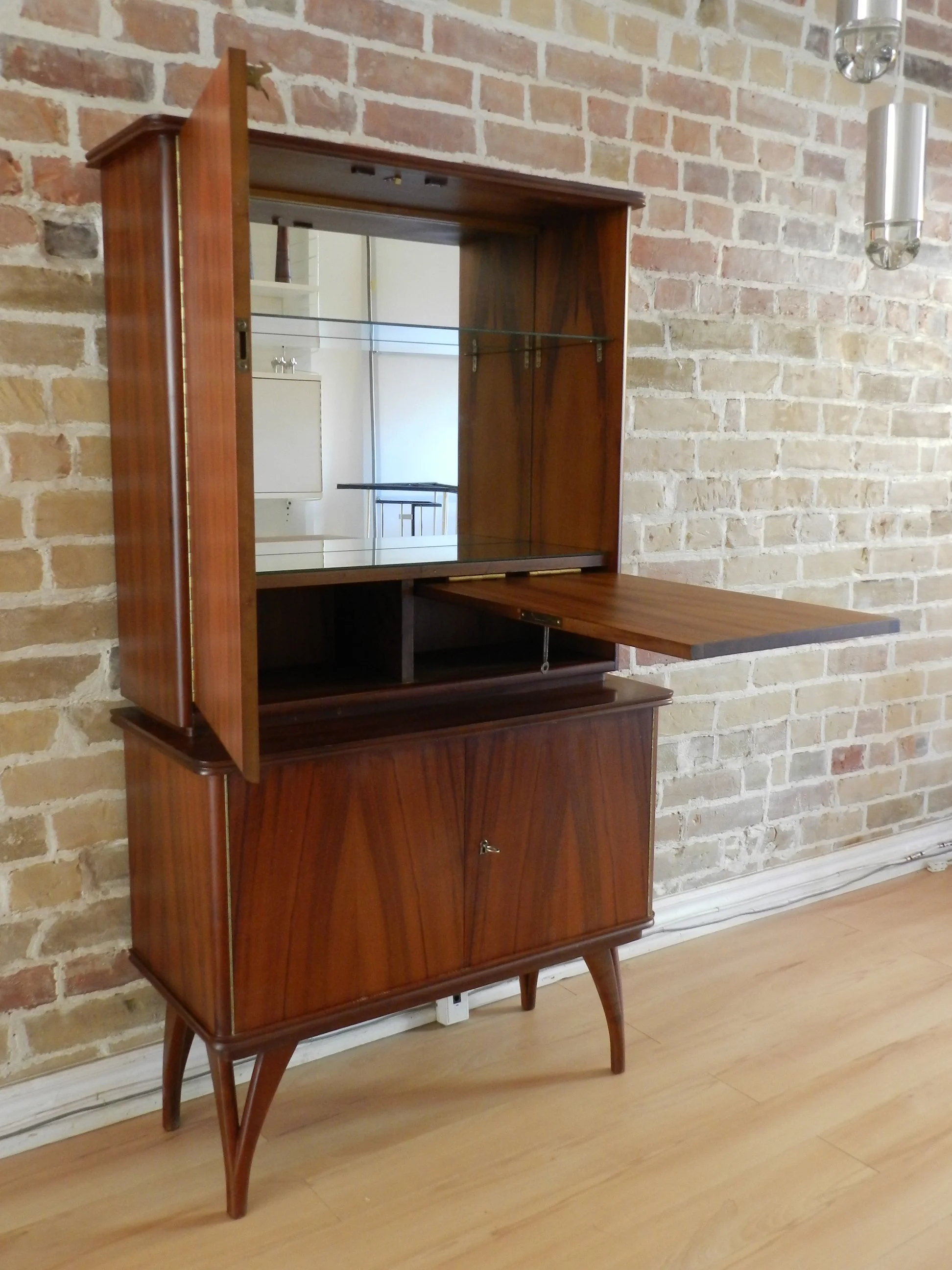 Compact rosewood bar cabinet with drop down door.  Scandianvia, 1960s.