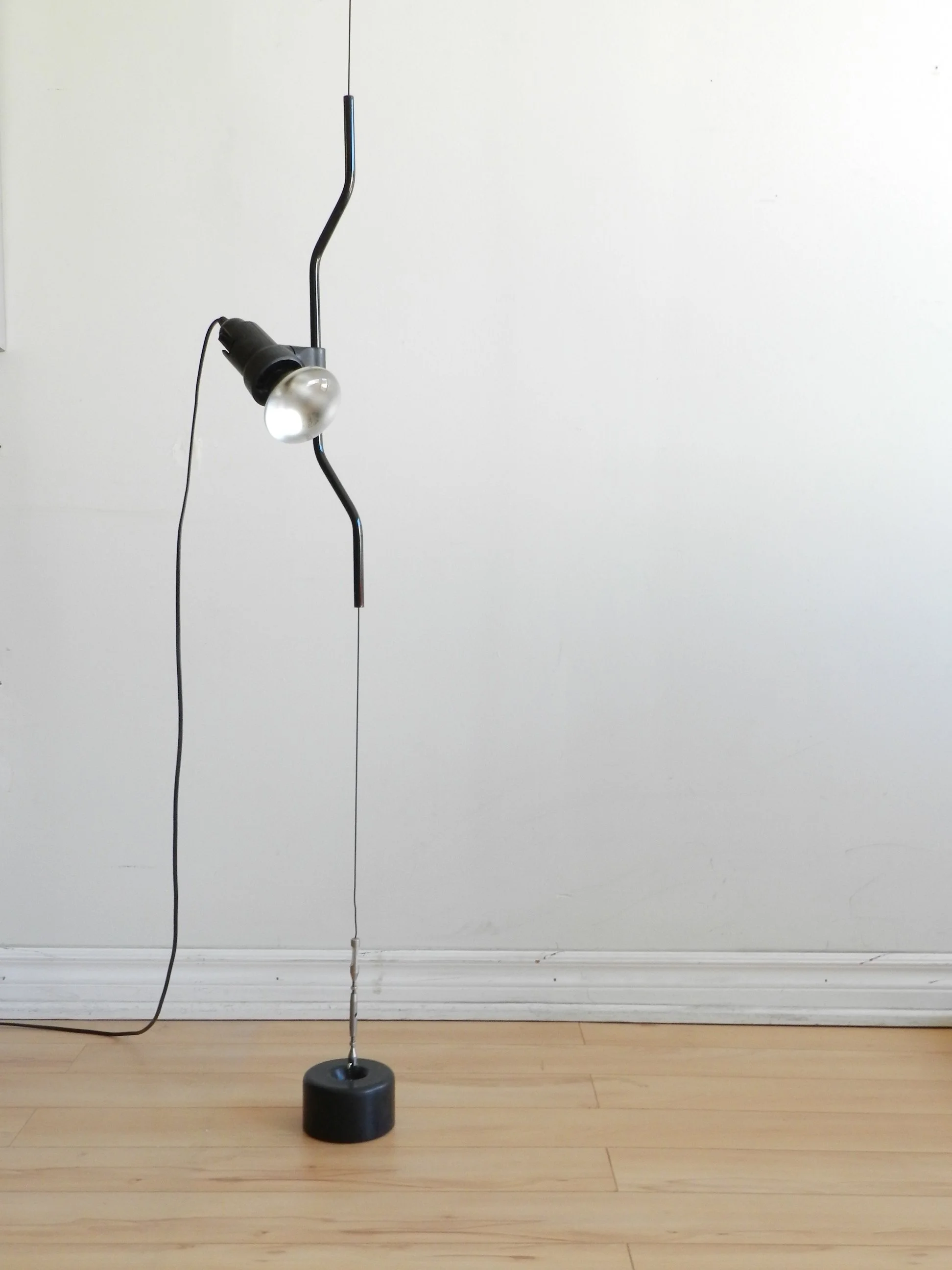 Modernist “Parentesi” floor to celing lamp designed by Achille Castiglioni and Pio Manzu for Flos.  Italy, 1970s.