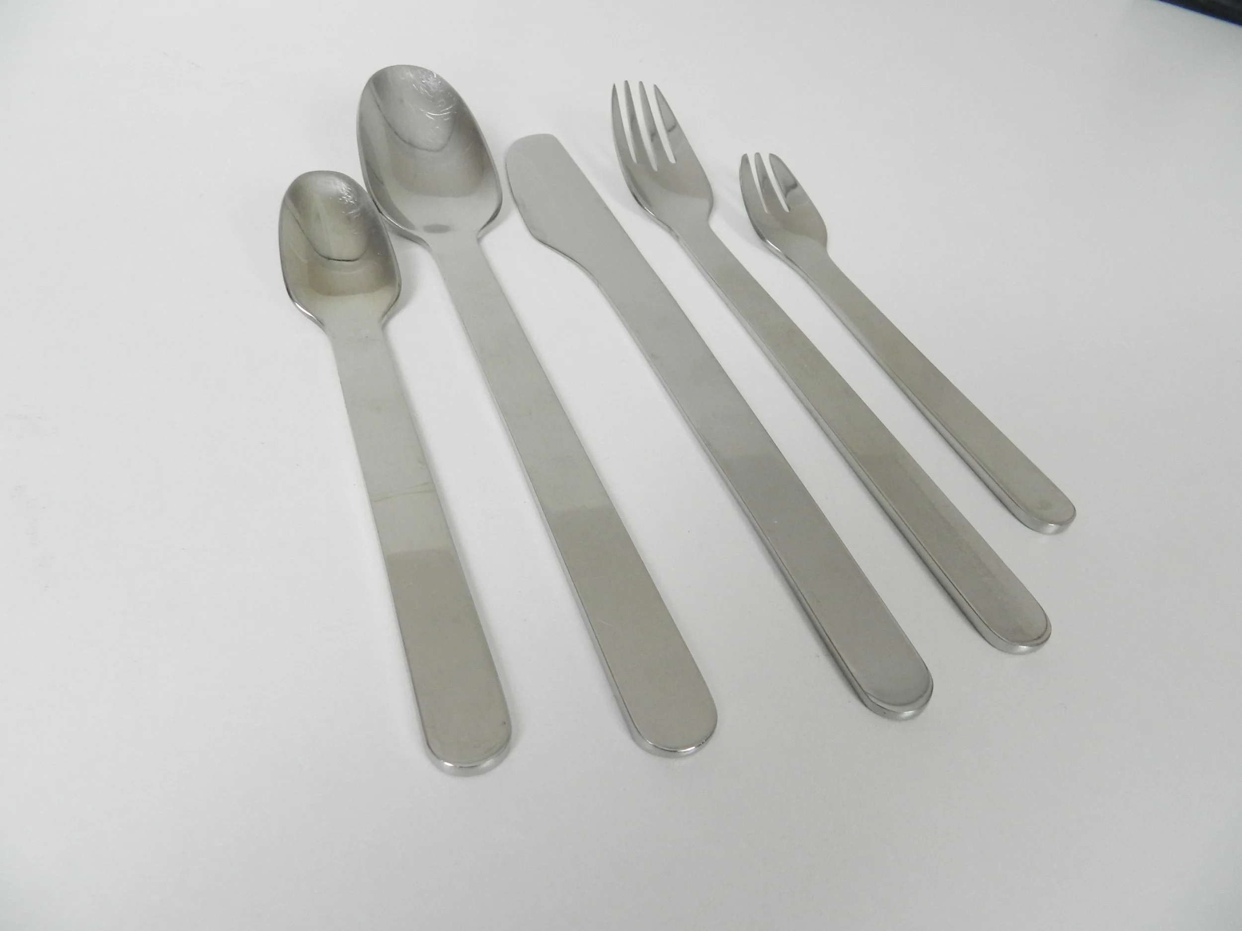 Stainless steel flatware designed by Louise Campbell for Georg Jensen, Denmark.