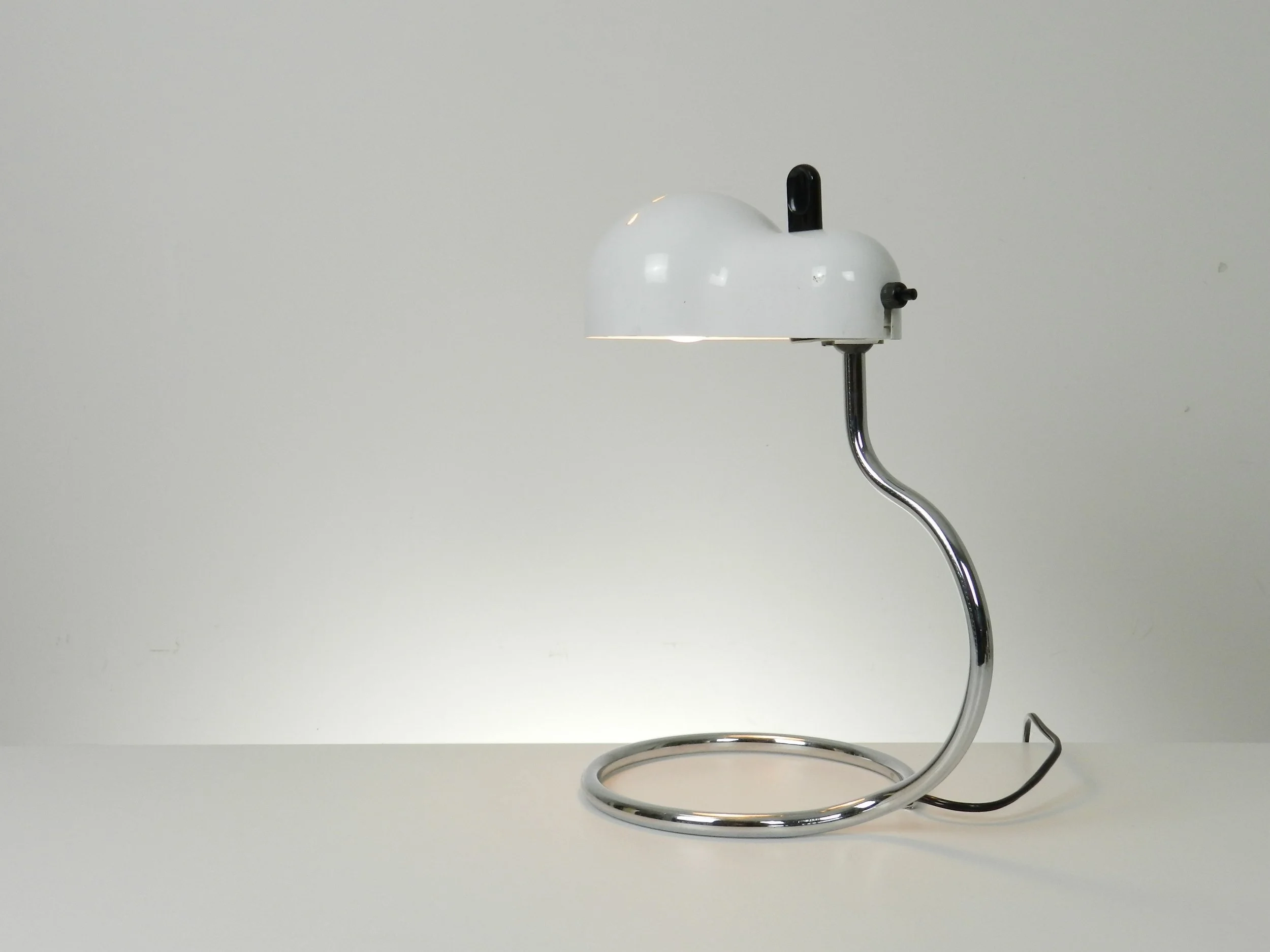 Minitopo table lamp designed by Joe Colombo for Stilnovo.  Italy, 1970s.