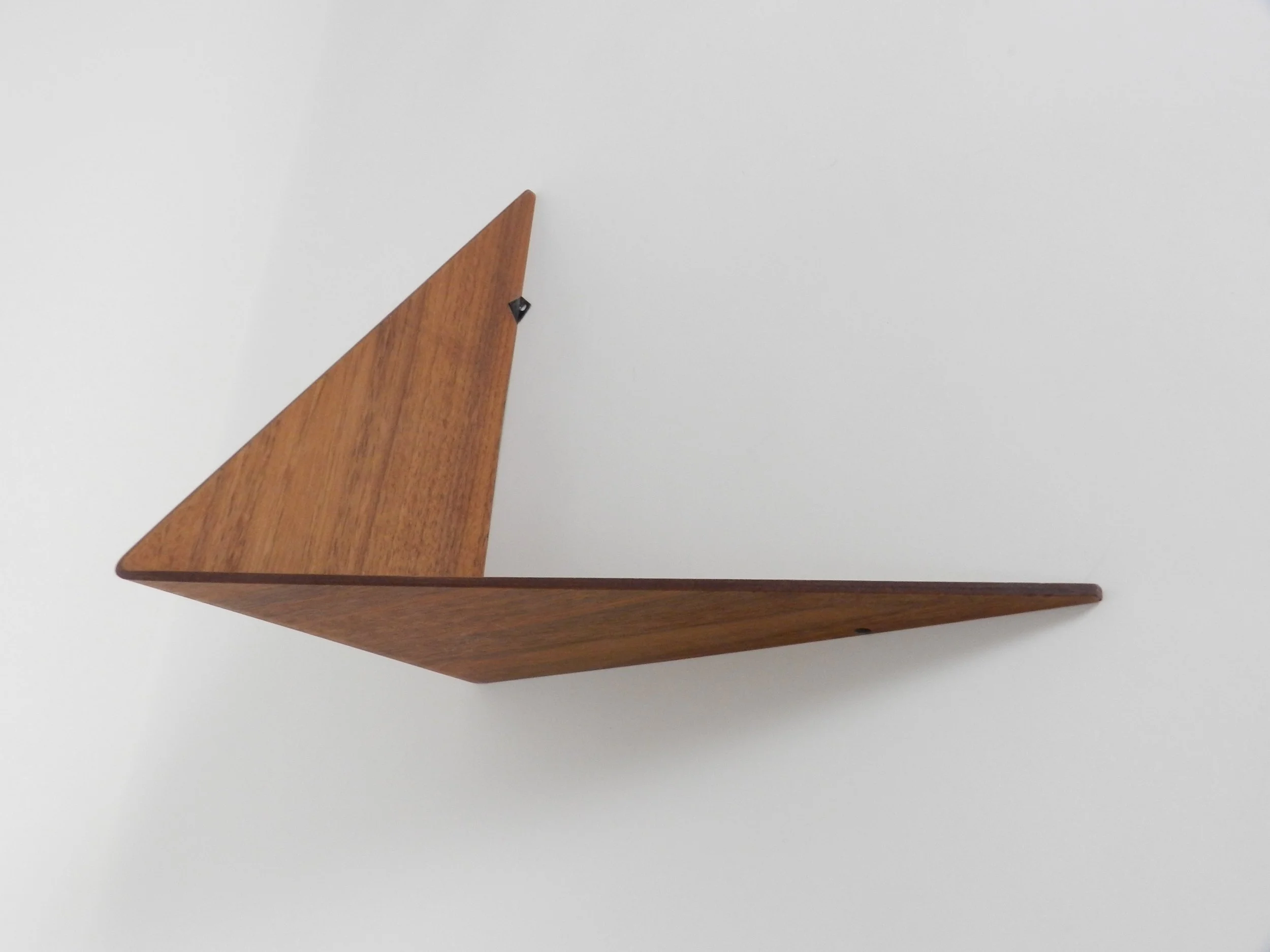 Wall shelf in bent plywood with teak veneer, designed by Poul Cadovius.  Denmark, 1960s.