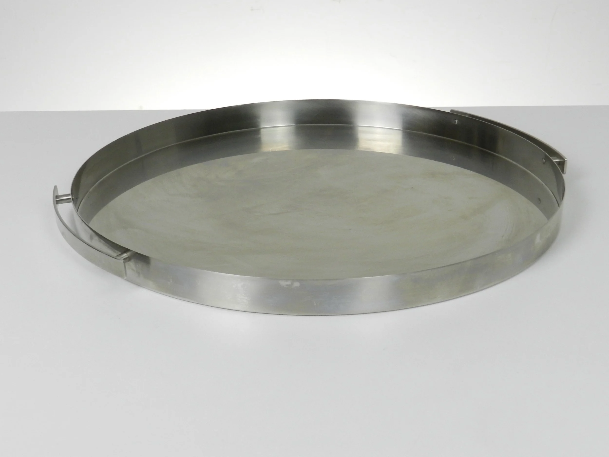 Stainless steel tray designed by Arne Jacobsen for Stelton.  Denmark, 1960s.