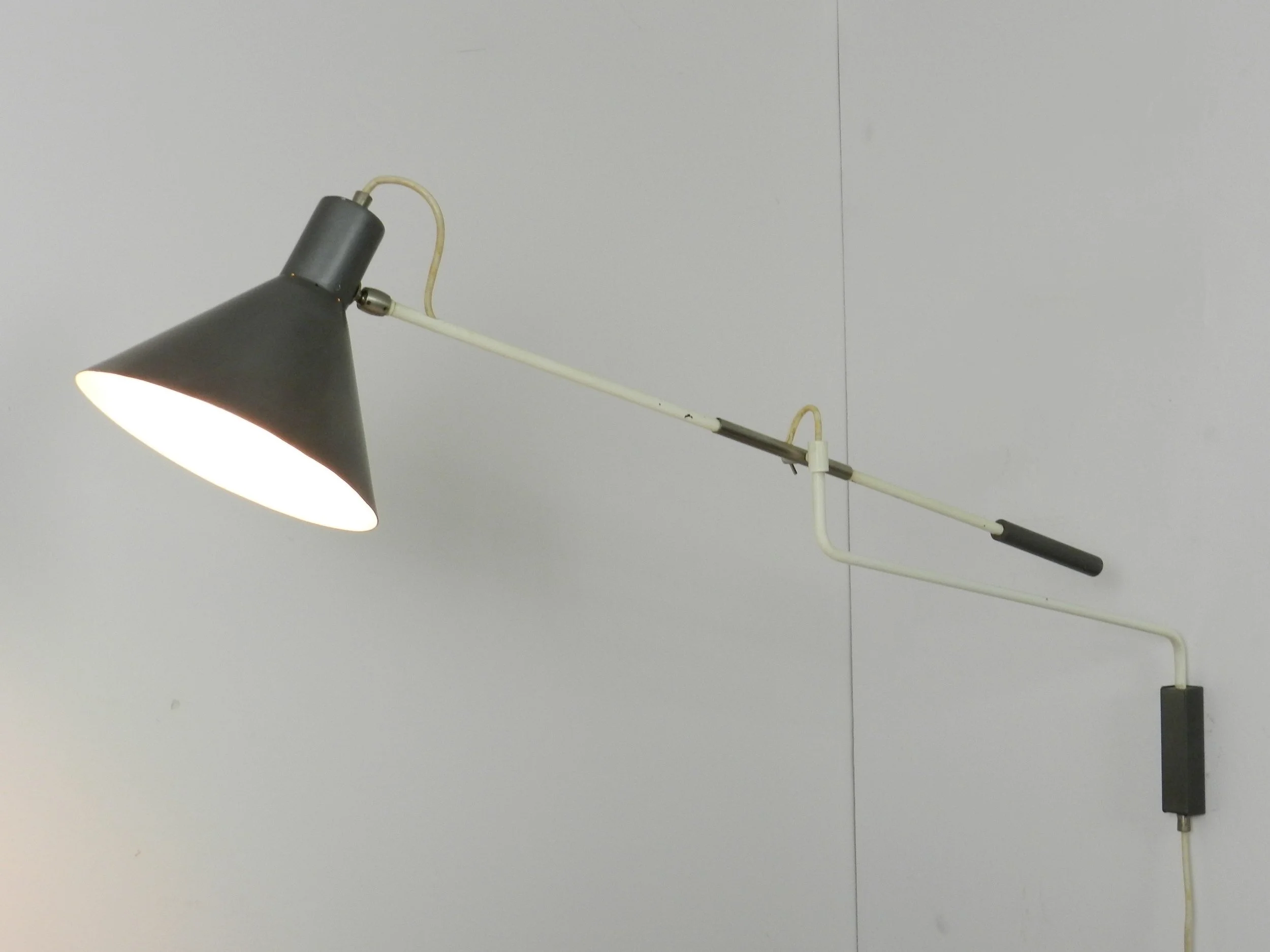 Mid century modern articulating wall lamp designed by JJM Hoogervorst for Anvia.  Netherlands, 1950s.