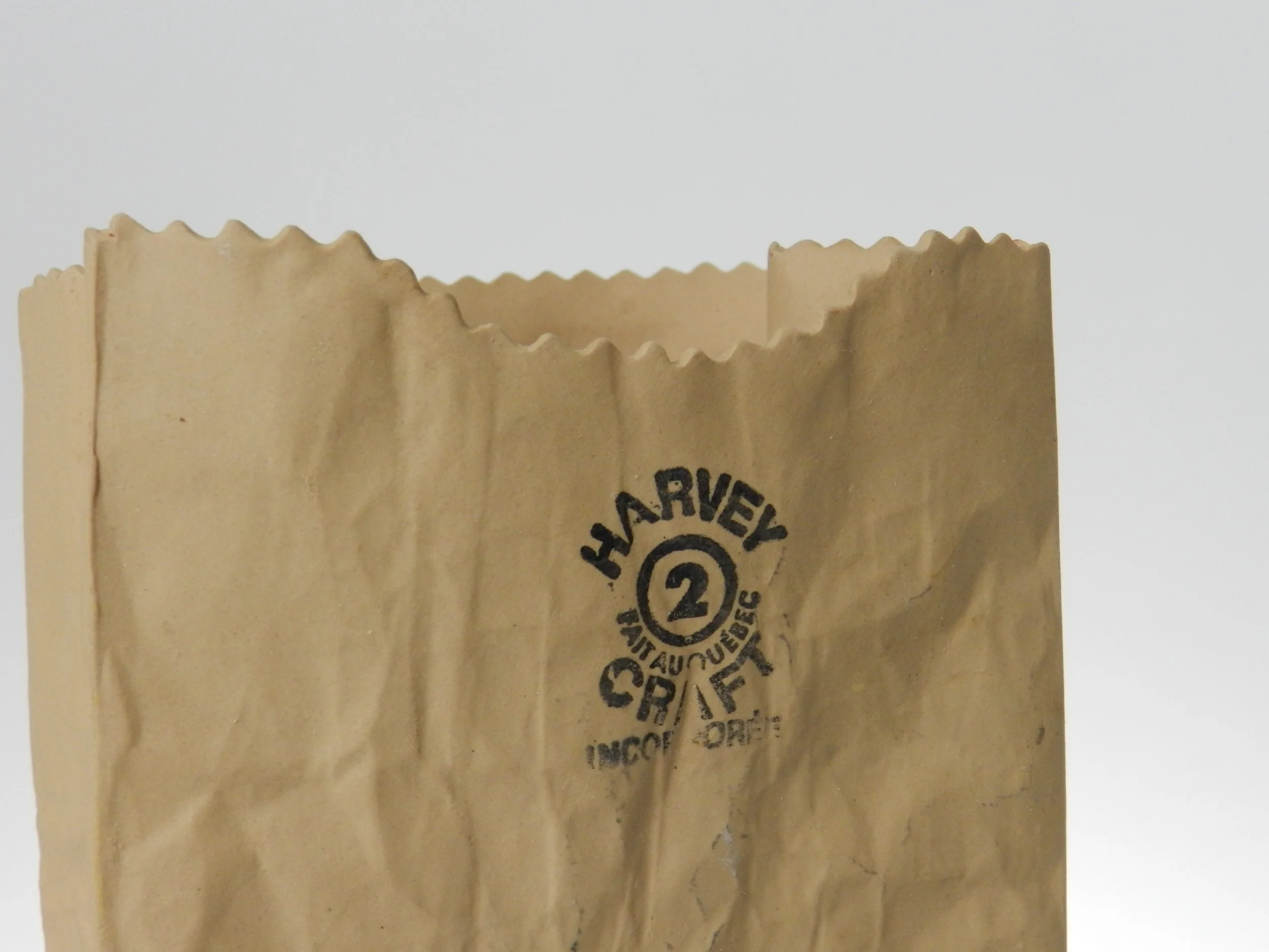 Ceramic paper bag vase designed by Michael Harvey.  Canada, 1980s.