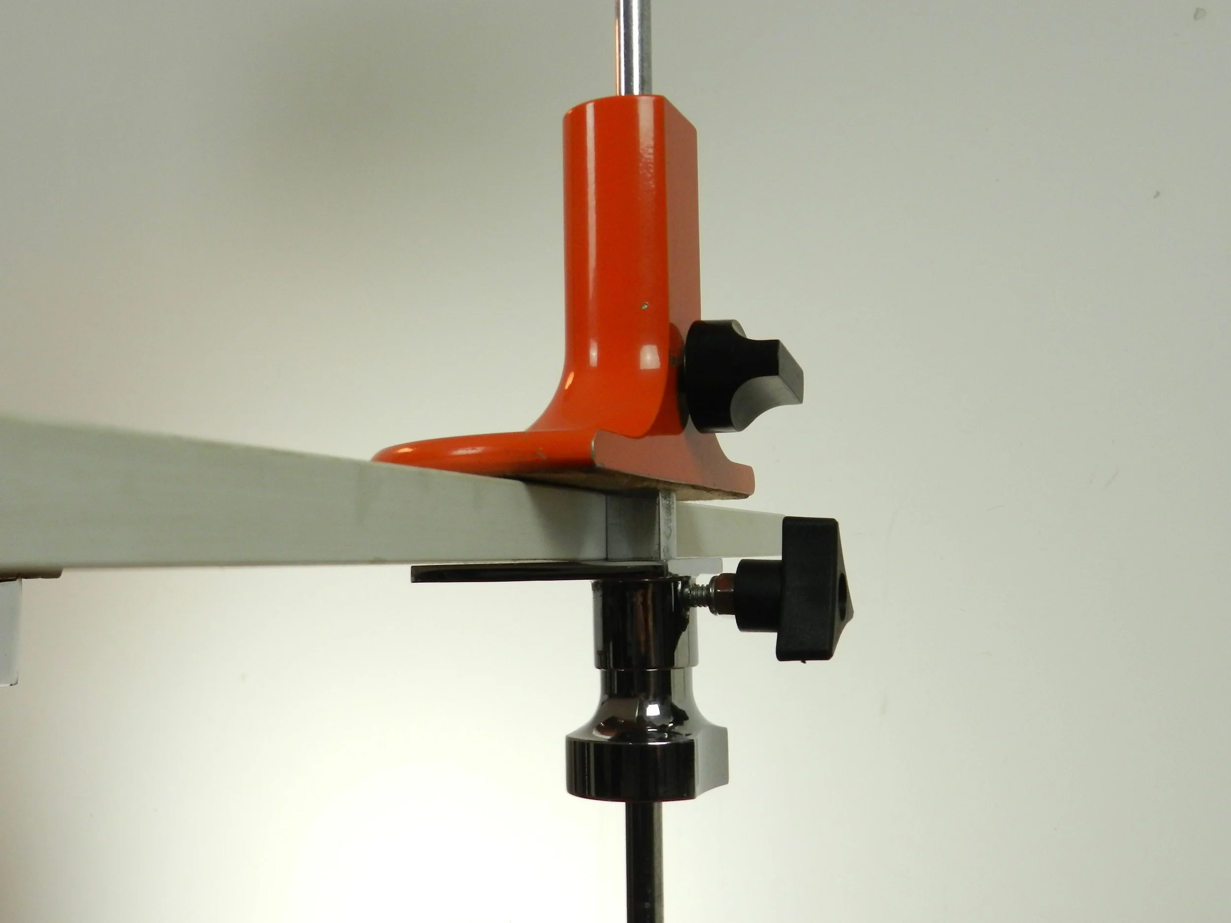 “Coupe” articulating clamp table lamp designed by Joe Colombo for Oluce.  Milano, Italy, 1960s.