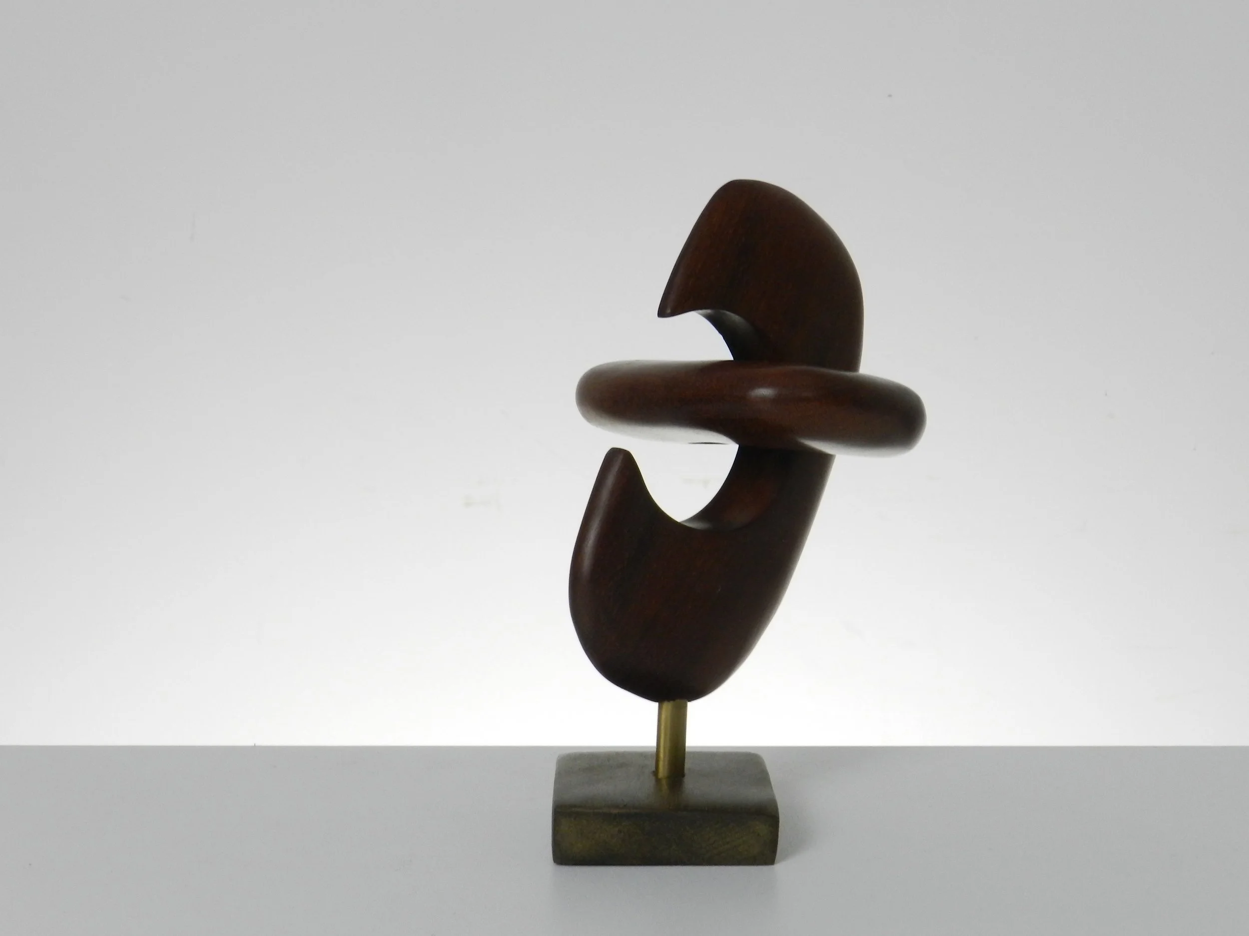 Modernist small sculpture in teak and brass, artist unknown.  circa 1960s.