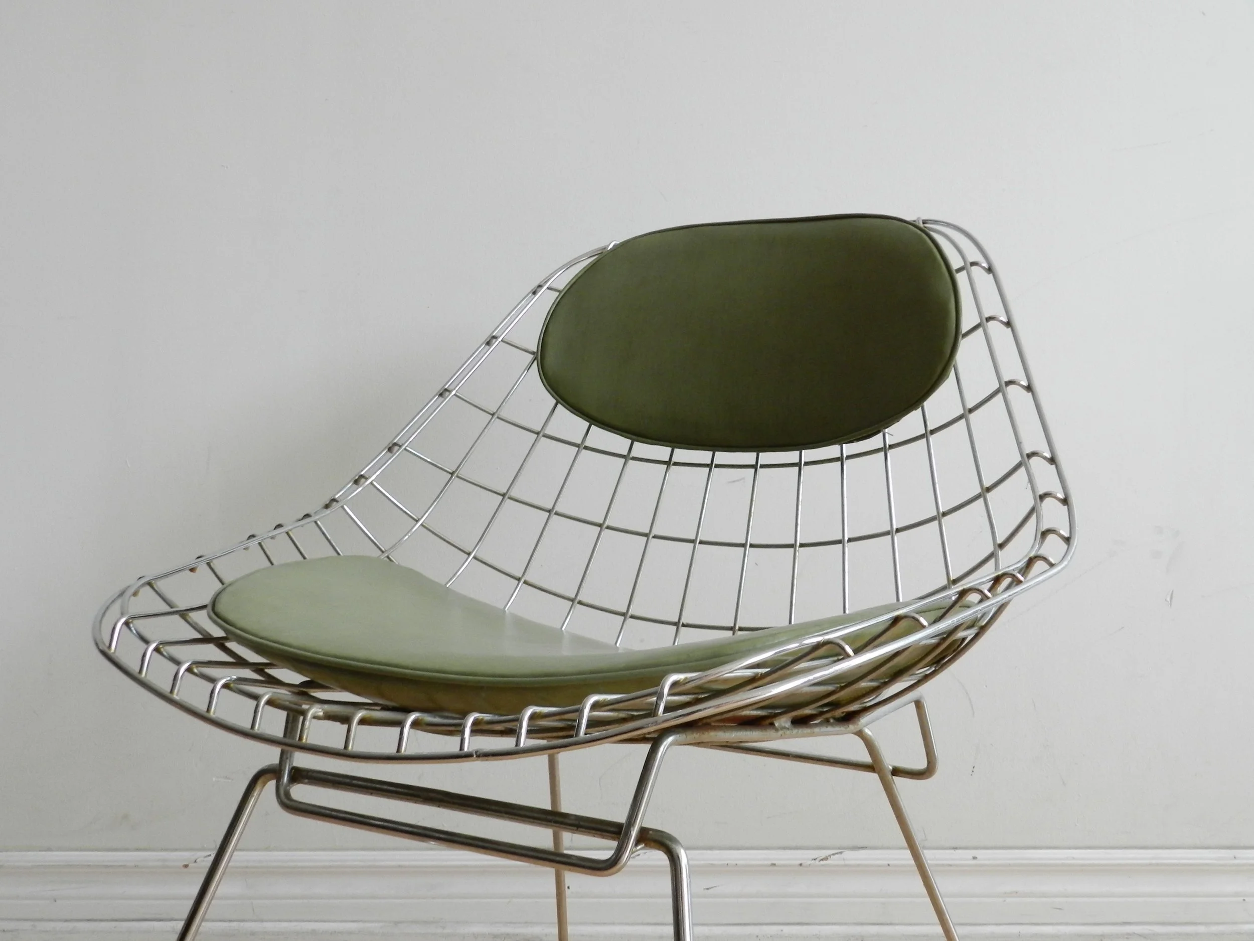 Pair of sculptural side chairs in chromed steel wire designed by Cees Braakman for Pastoe.  Netherlands, 1960s.