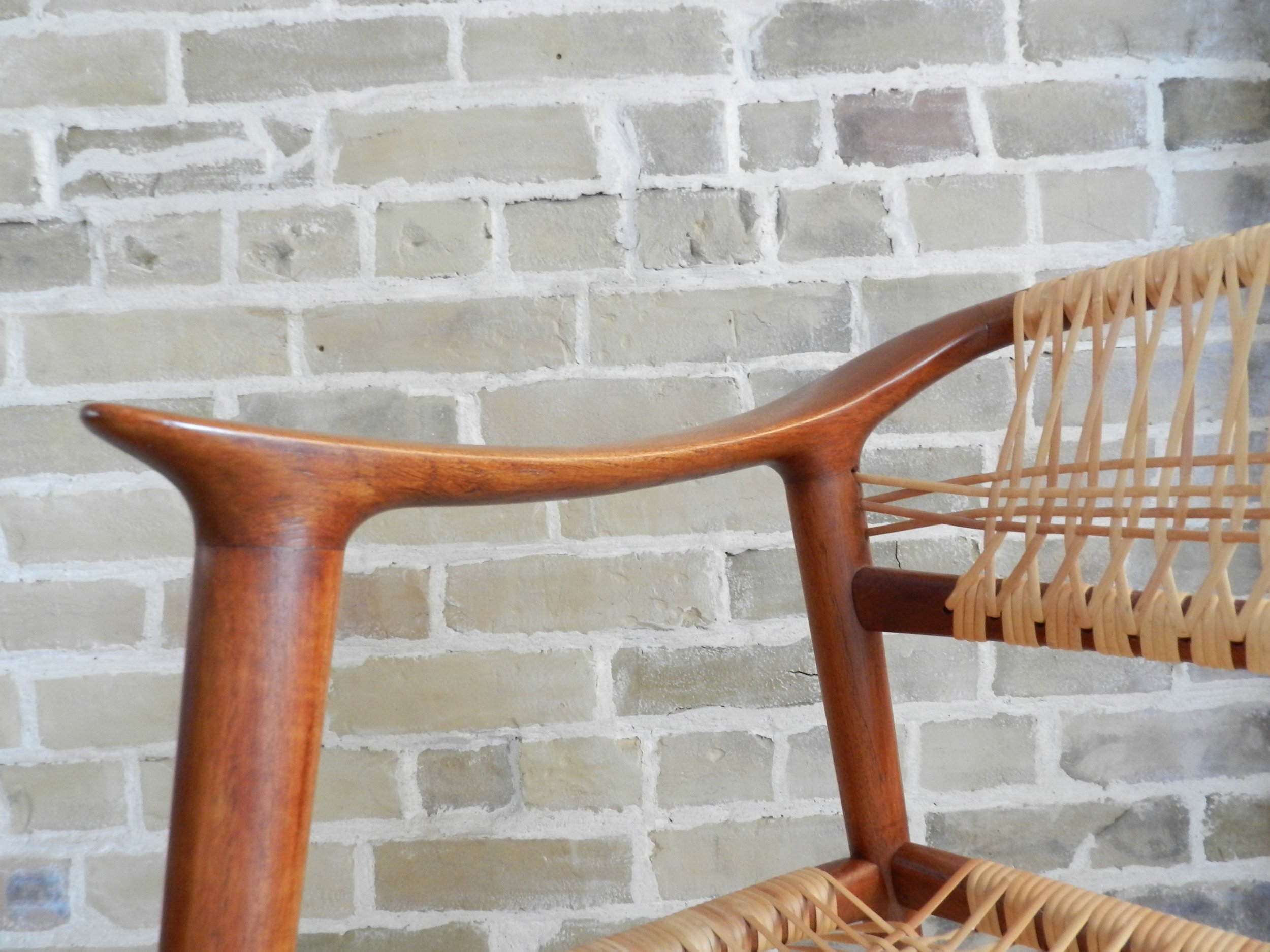Pair of teak and cane “Bambi” arm chairs designed by Rolf Rastad and Adolf Relling for Gustav Bahus.  Norway, 1950s.