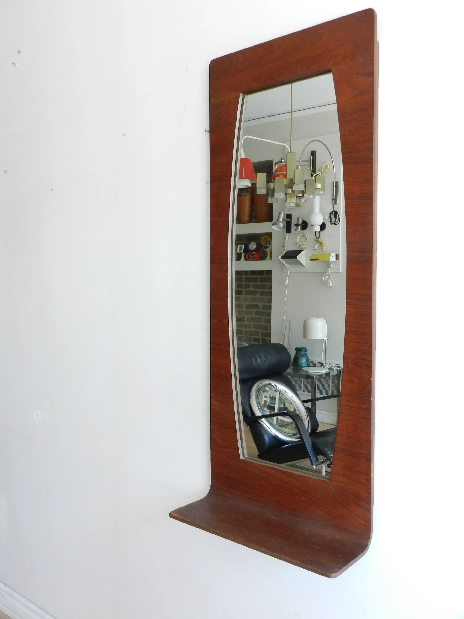 Bent plywood with teak veneer entry wall mirror with shelf.  Canada, 1960s.