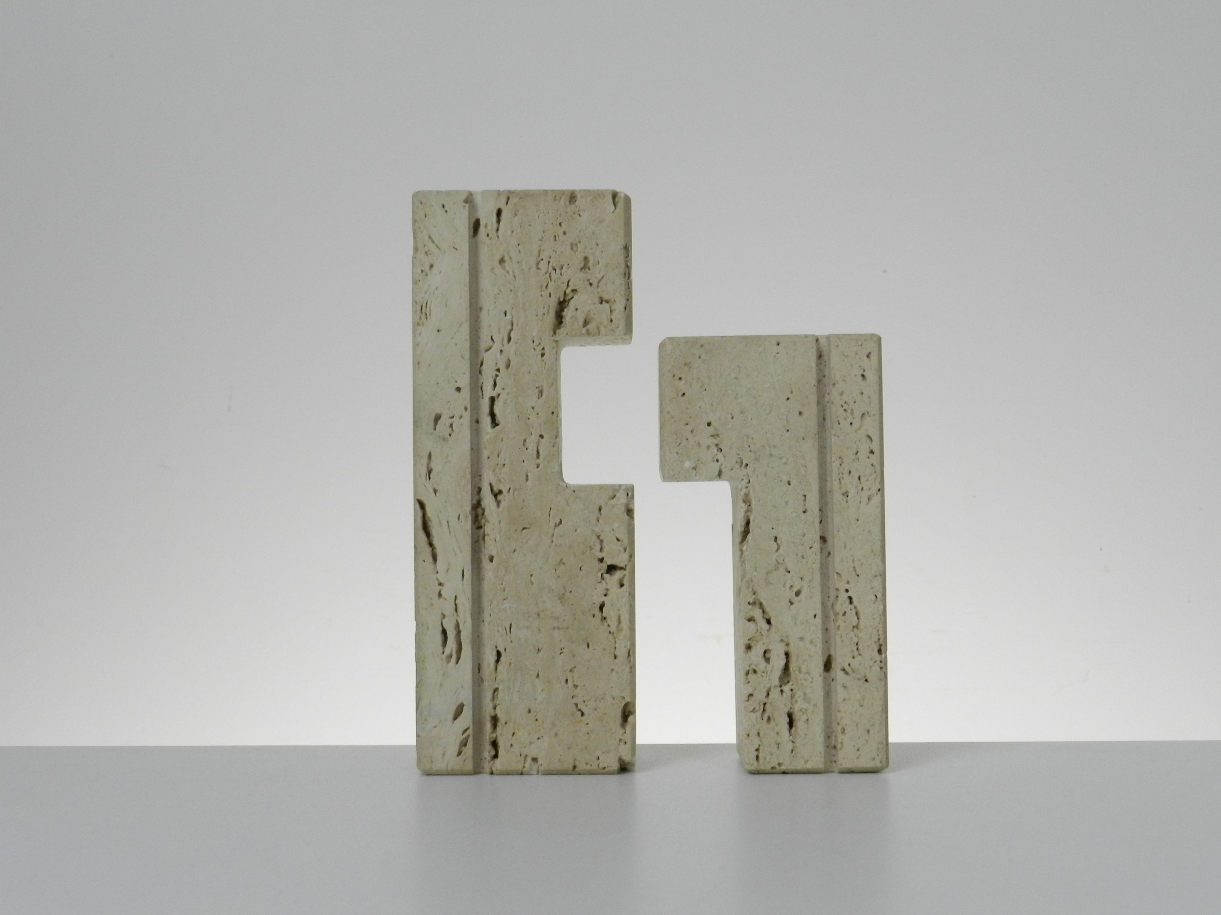 Travertine nesting candle holders designed by Fratelli Manelli.  Italy, 1960s.