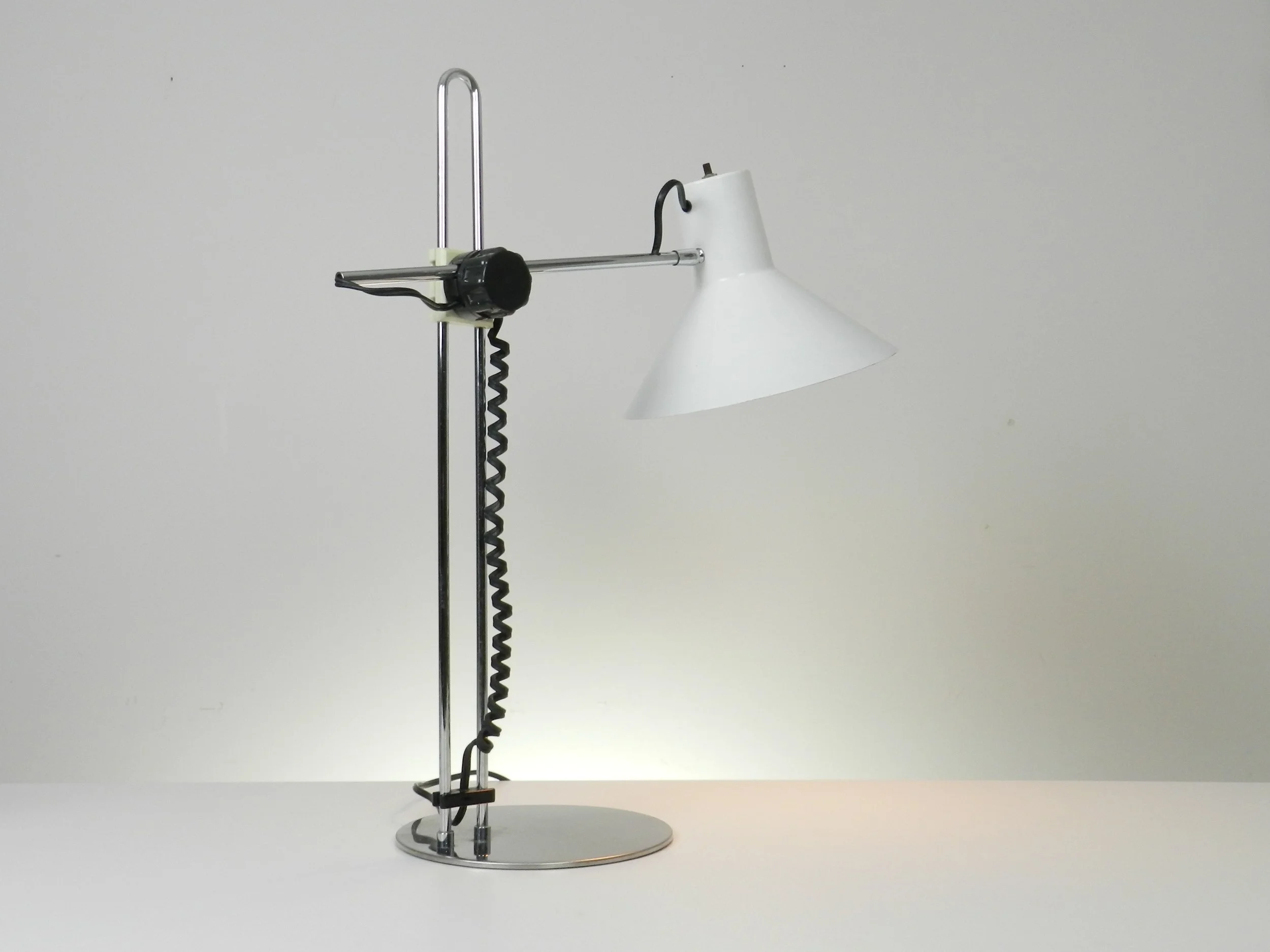 Modernist desk lamp in chrome, plastic and enameled metal by Nanbu.  Japan, 1970s.