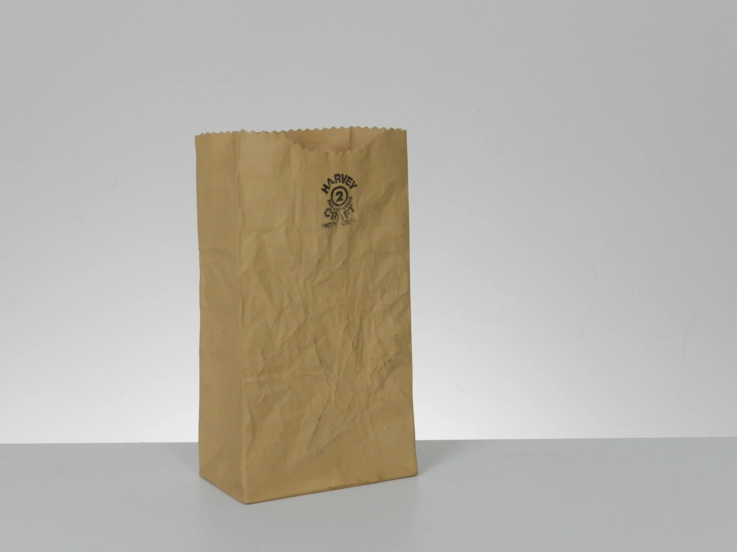 Ceramic paper bag vase designed by Michael Harvey.  Canada, 1980s.