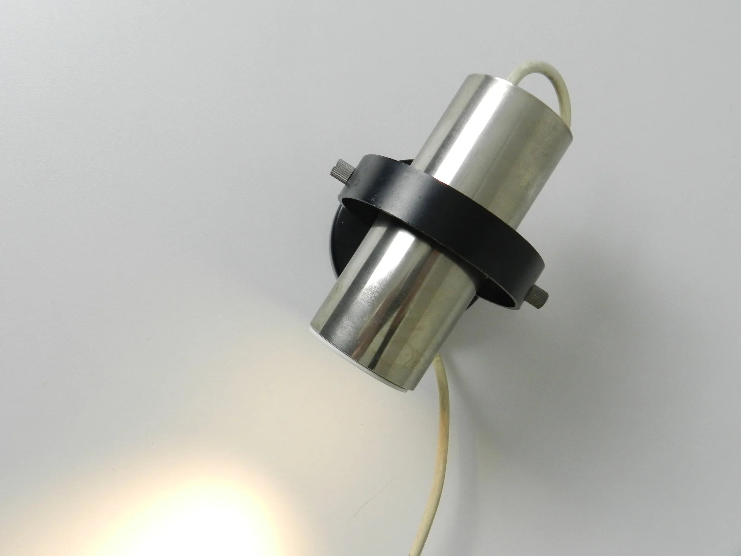 Modernist wall mounted spot lamp by Raak.  Netherlands, 1960s.