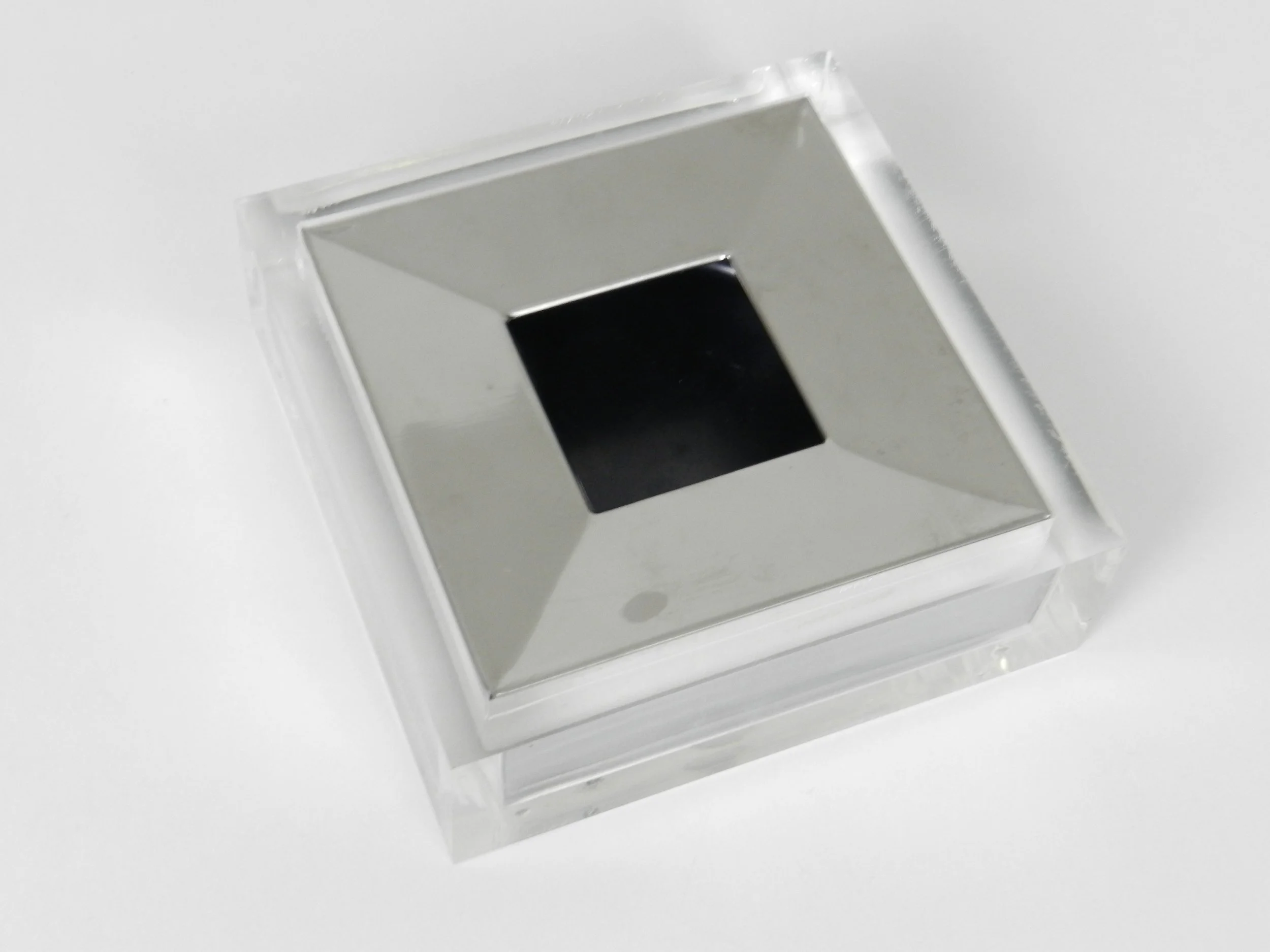 Lucite and chrome ashtray designed by Fabio Manlio Ciocca for Guzzini.  Italy, 1970s.