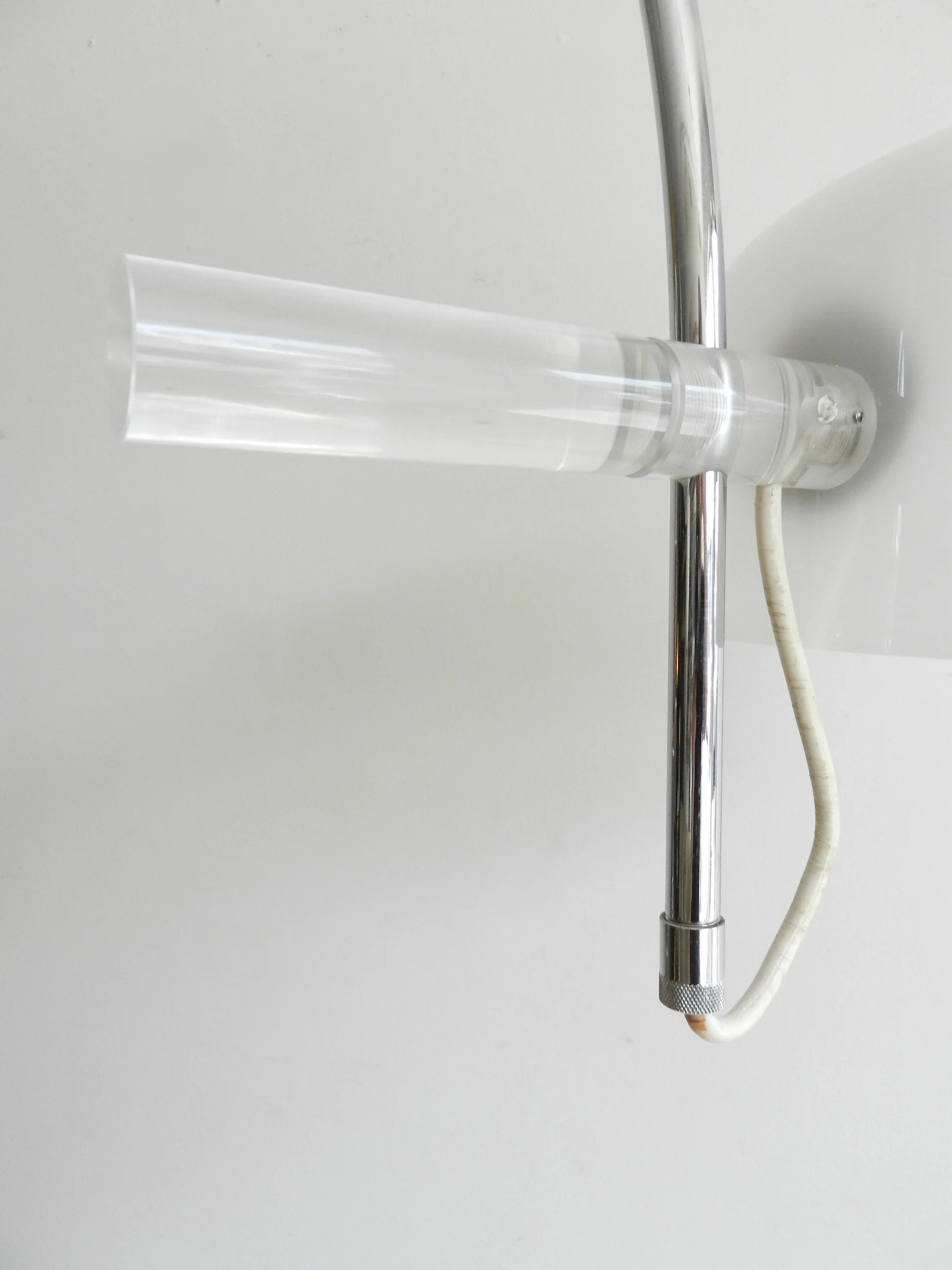 Modernist arc floor lamp by Raak. Chromed steel with acrylic shade and lucite hardware.  Netherlands, 1970s.