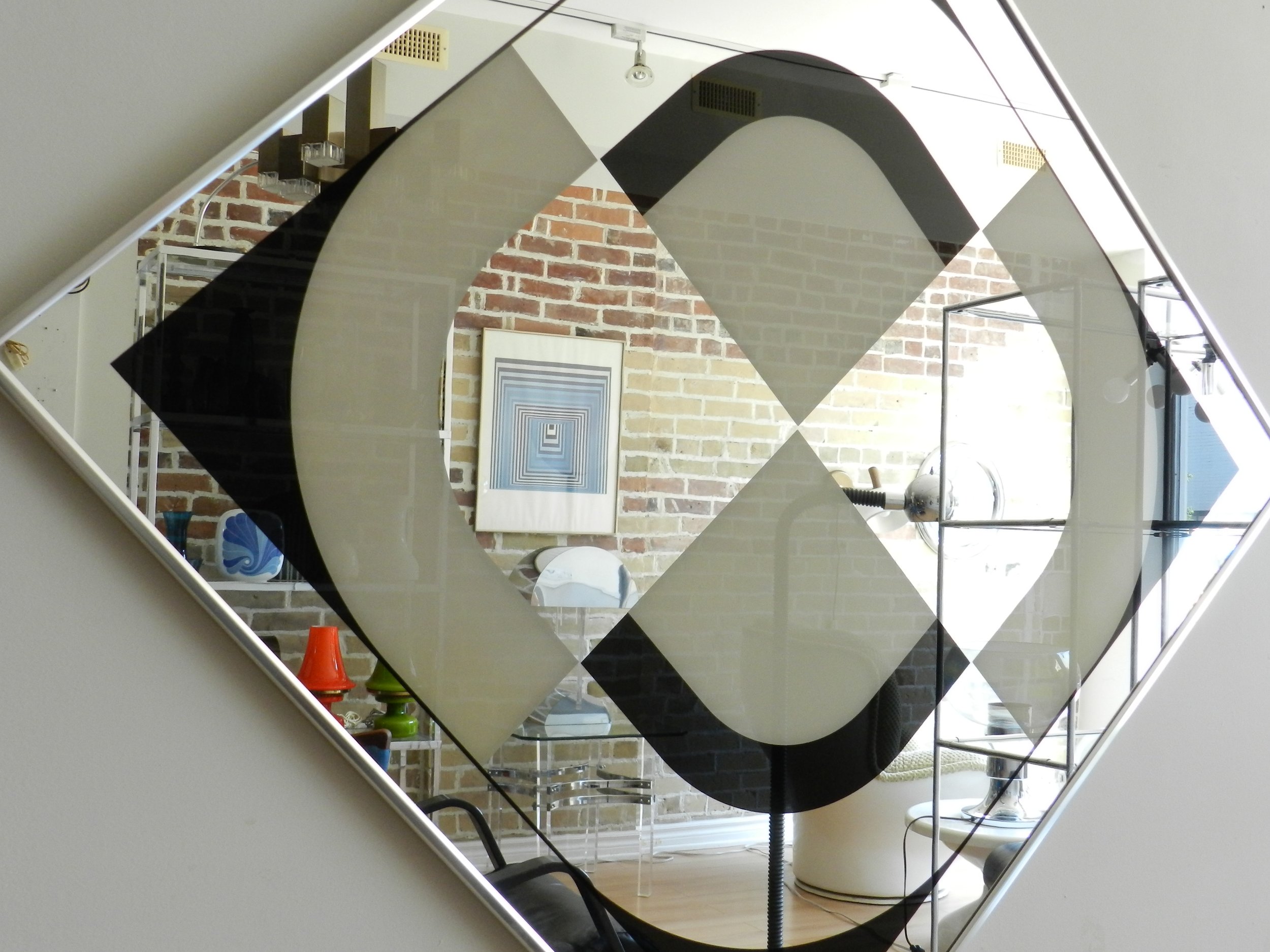 Op Art graphic mirror by Turner Design. Can be hung horizontally or diagonally.  USA, 1970s.