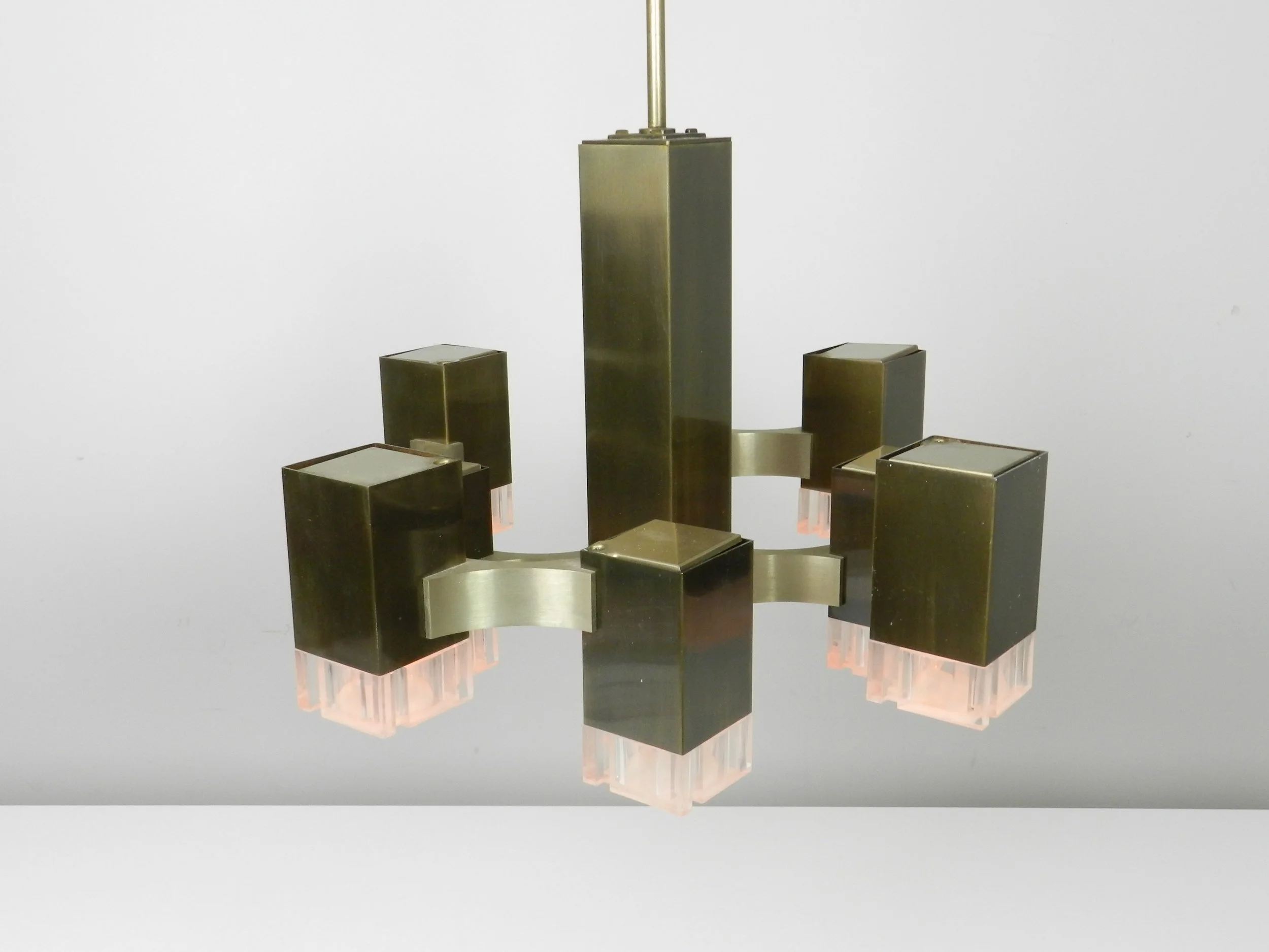 Modernist nine light “Cubic” chandelier designed by Gaetano Sciolari. In bronze plated metal with acrylic diffusers.  Italy, 1960s.