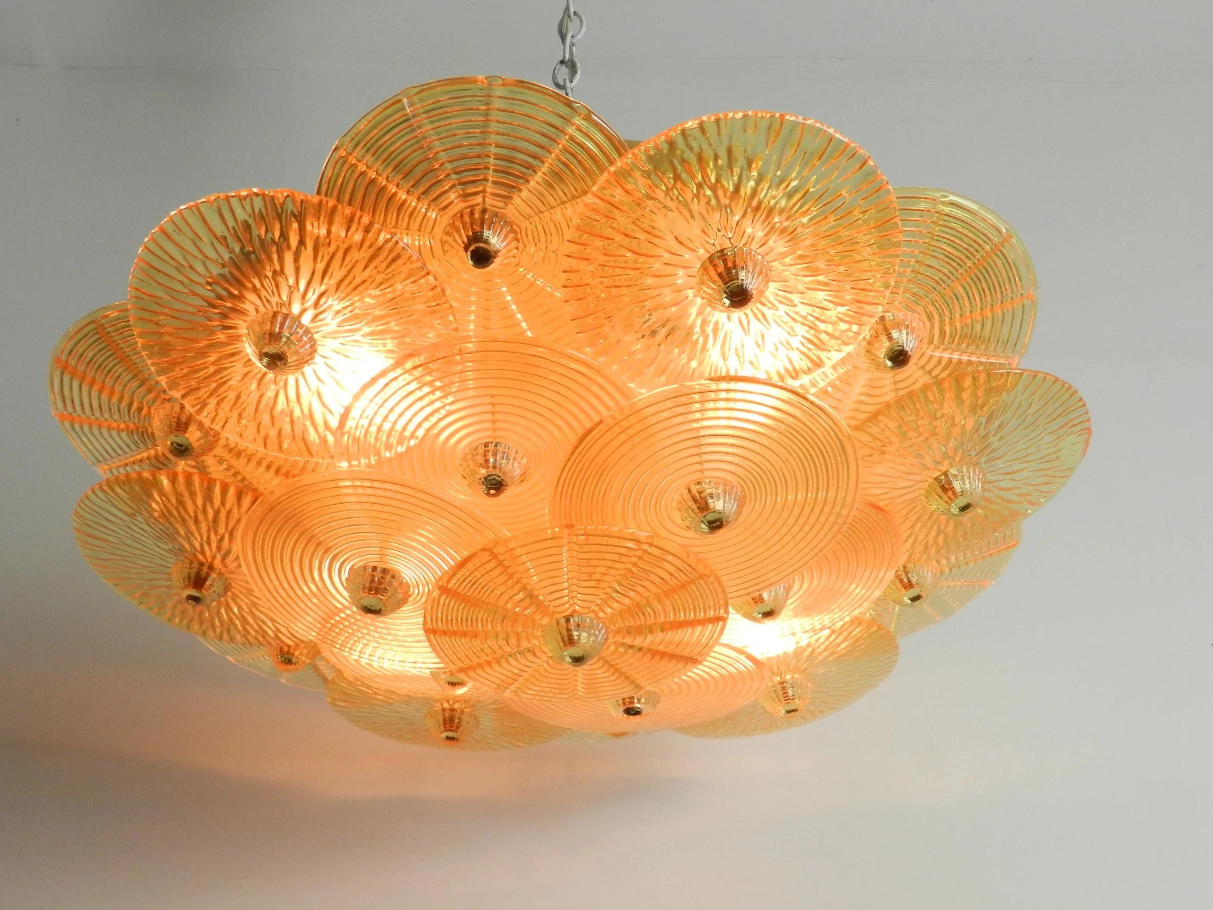 Large murano amber glass disc chandlier from Italy.