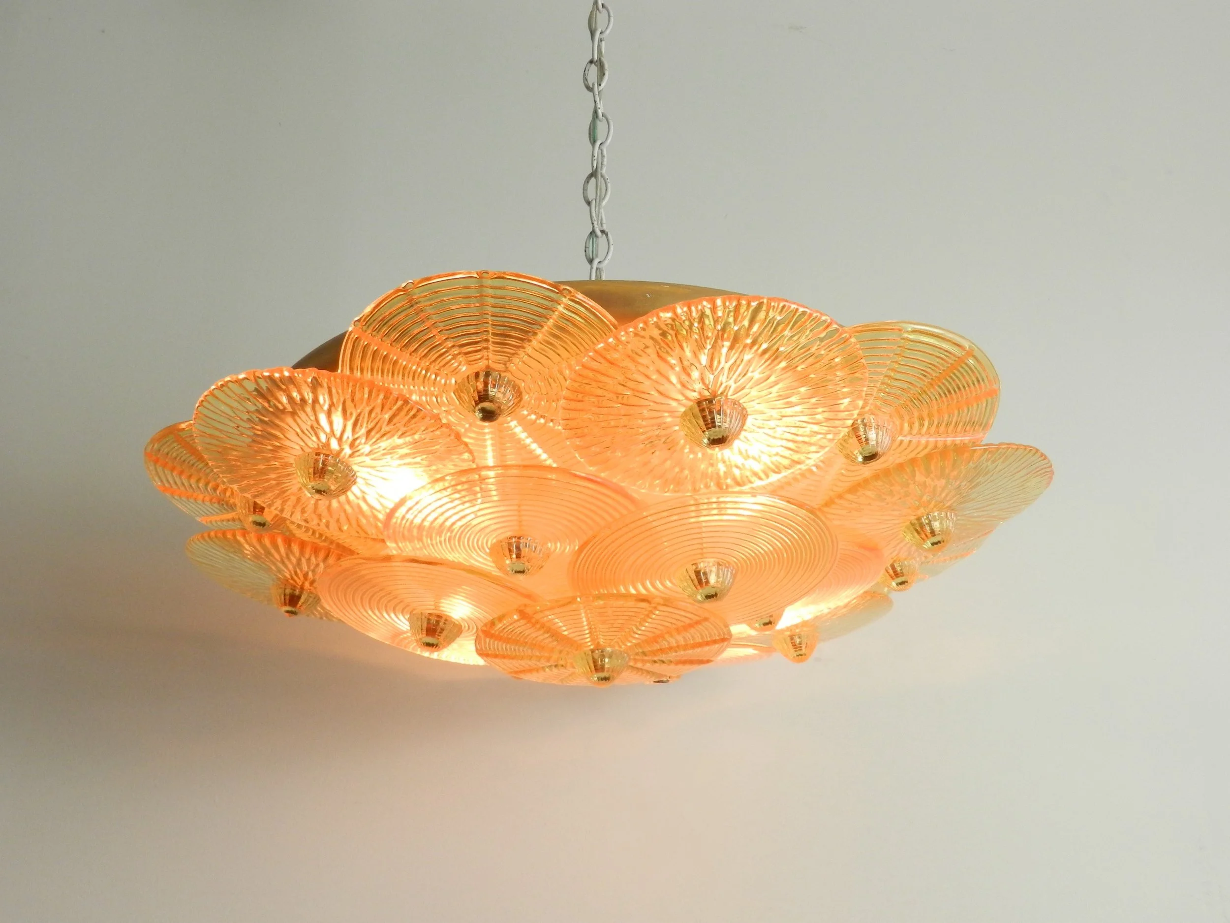 Large murano amber glass disc chandlier from Italy.