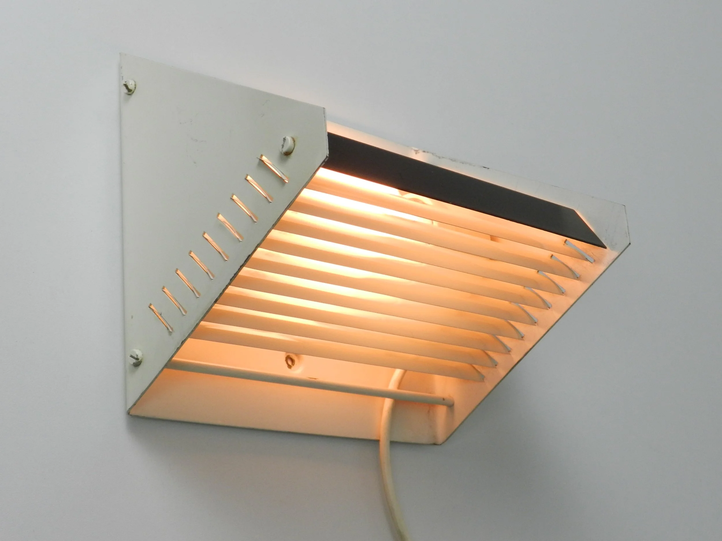 Mid century modern rare wall lamp by Raak.  Netherlands, 1960s.