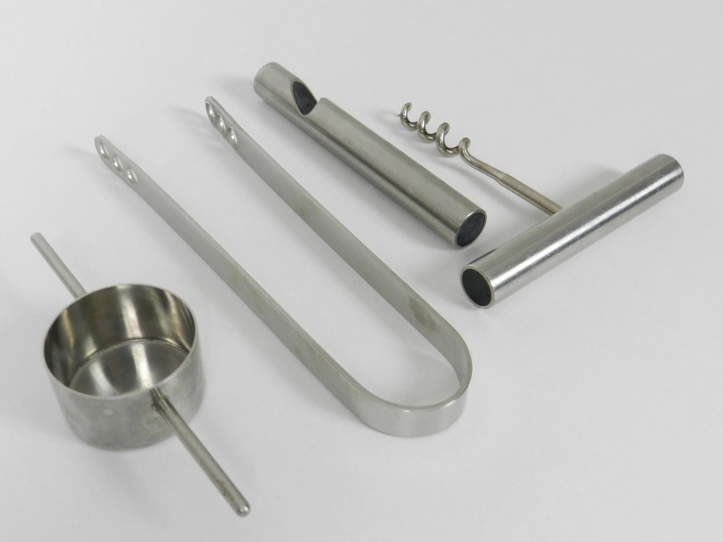 Set of four bar utensils designed by Arne Jacobsen and Peter Holmblad.  Denmark, 1970s.