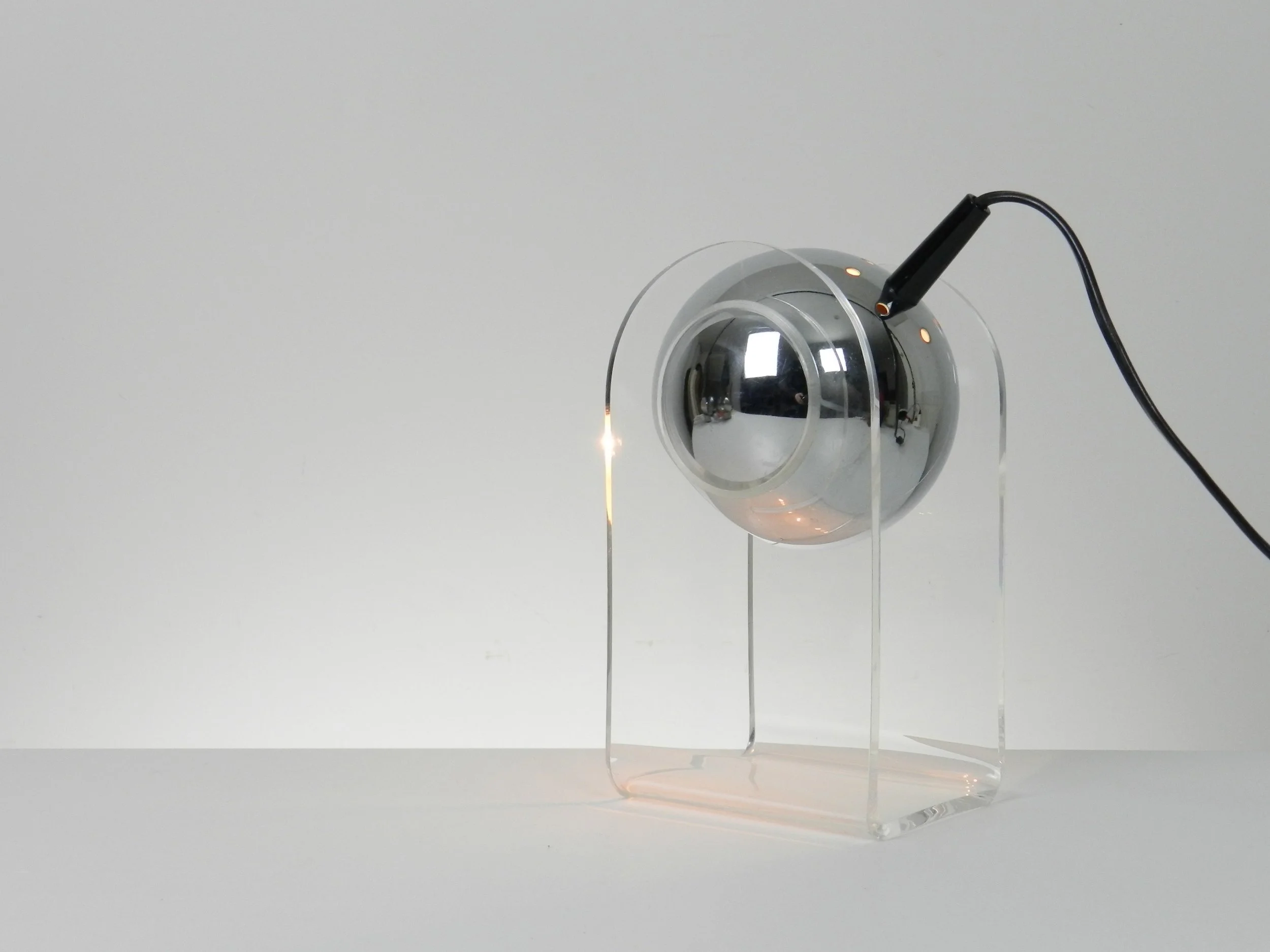 Space age eyeball lamp in the style of Gino Sarfatti. Chromed steel and lucite.  circa 1980s.