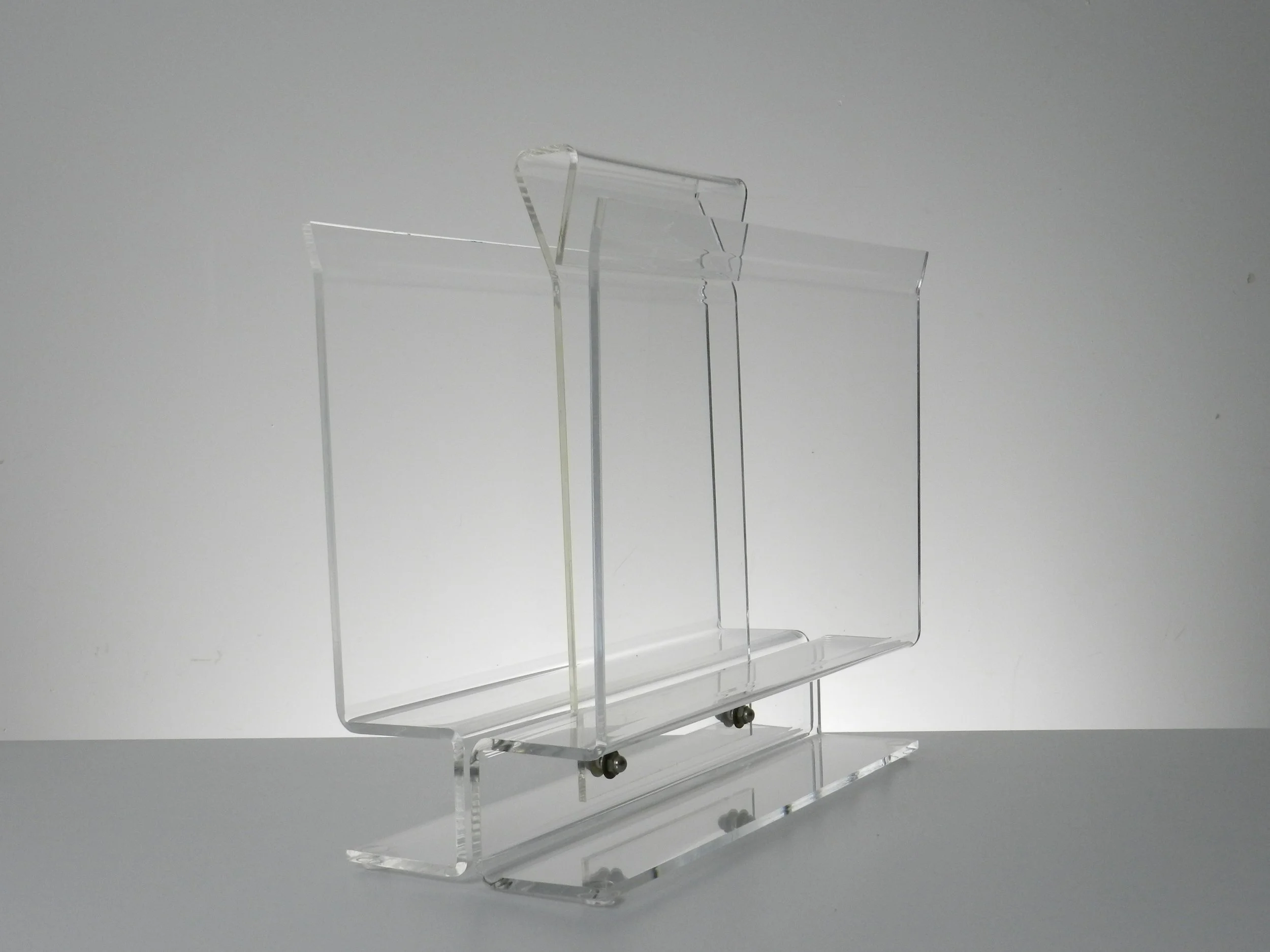 Vintage modernist lucite magazine rack.  circa 1980s.