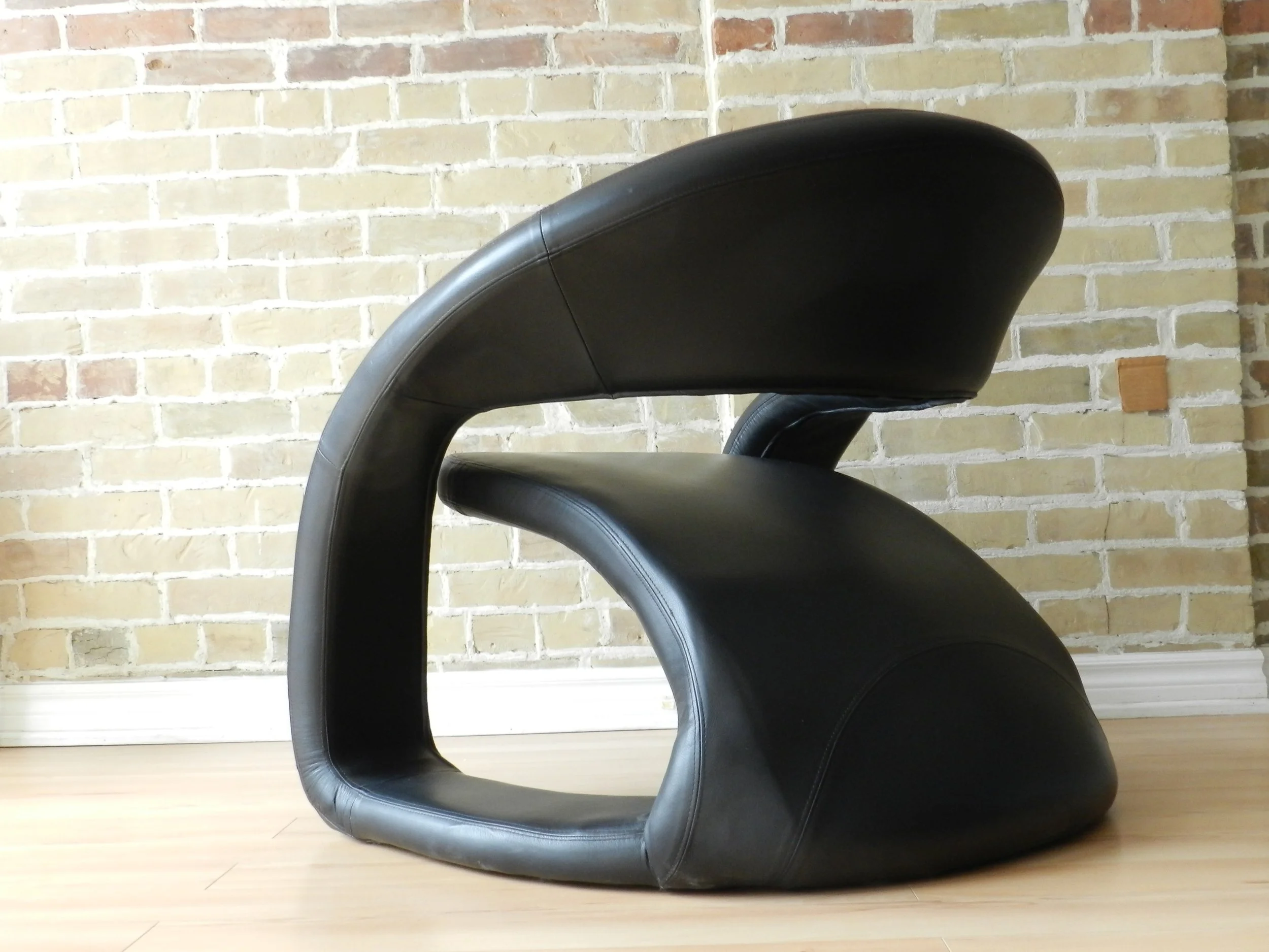 Sculptural Tougue lounge chair in black leather by Jaymar.  Canada, 1990s.