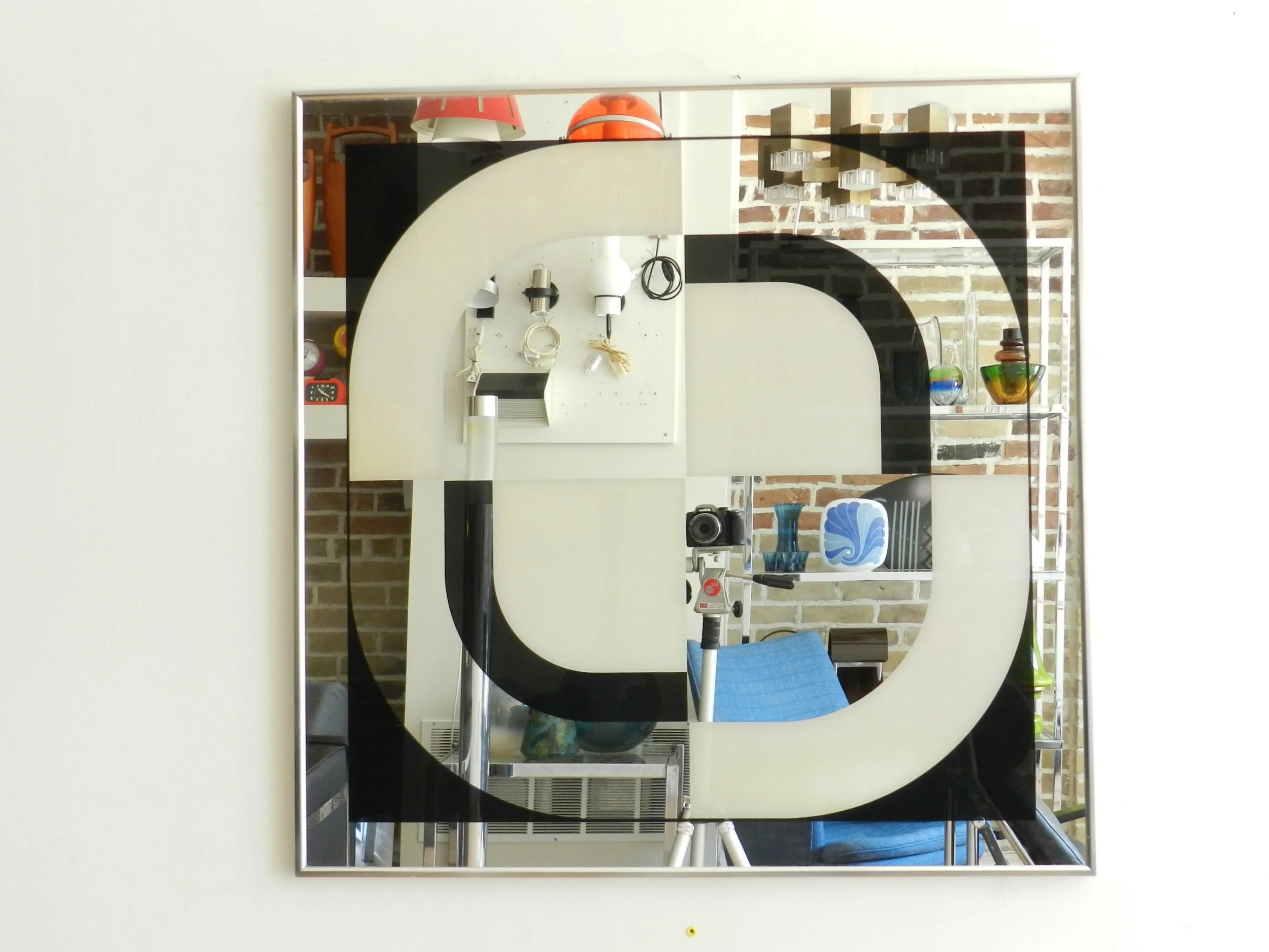 Op Art graphic mirror by Turner Design. Can be hung horizontally or diagonally.  USA, 1970s.