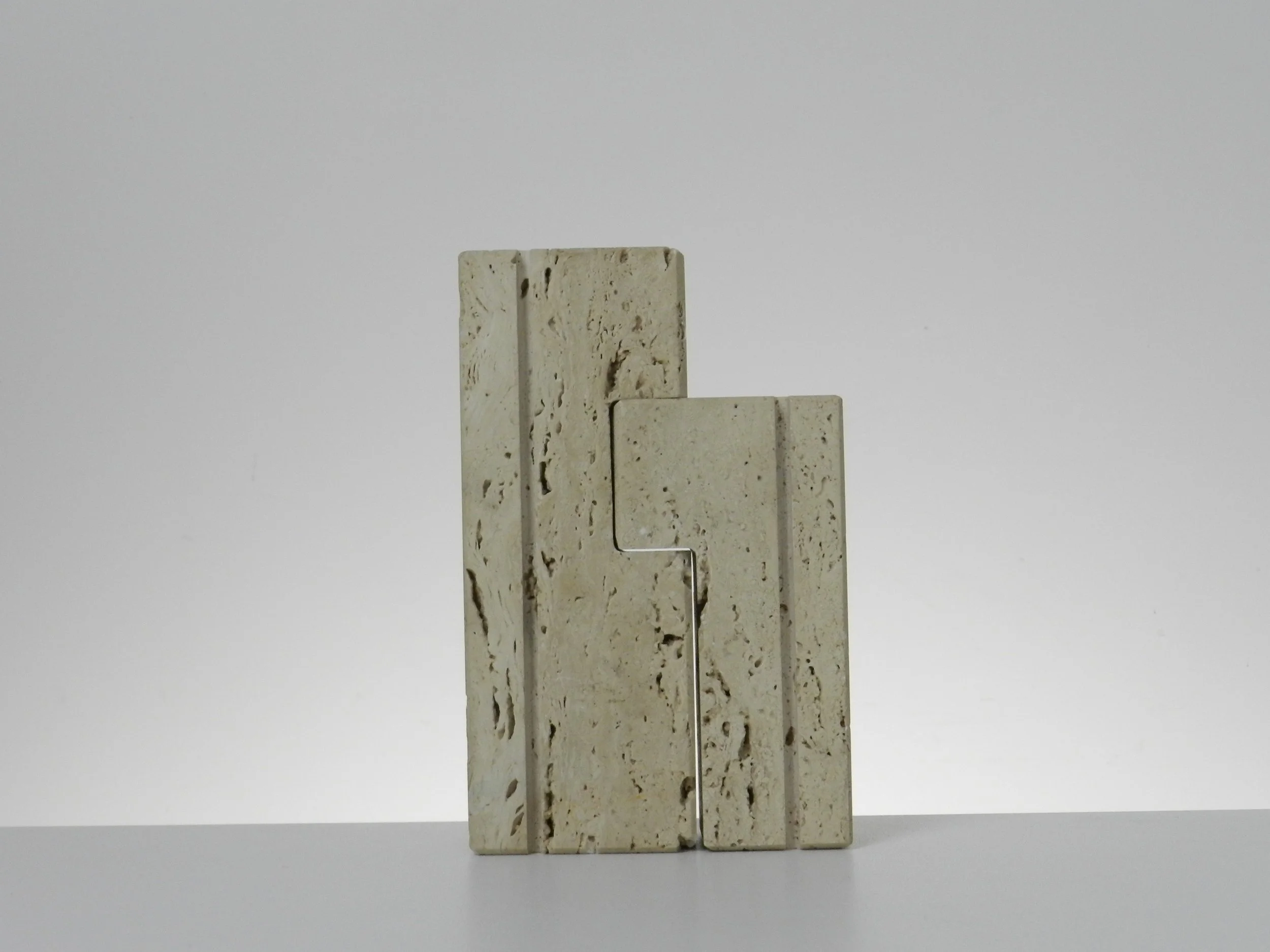 Travertine nesting candle holders designed by Fratelli Manelli.  Italy, 1960s.
