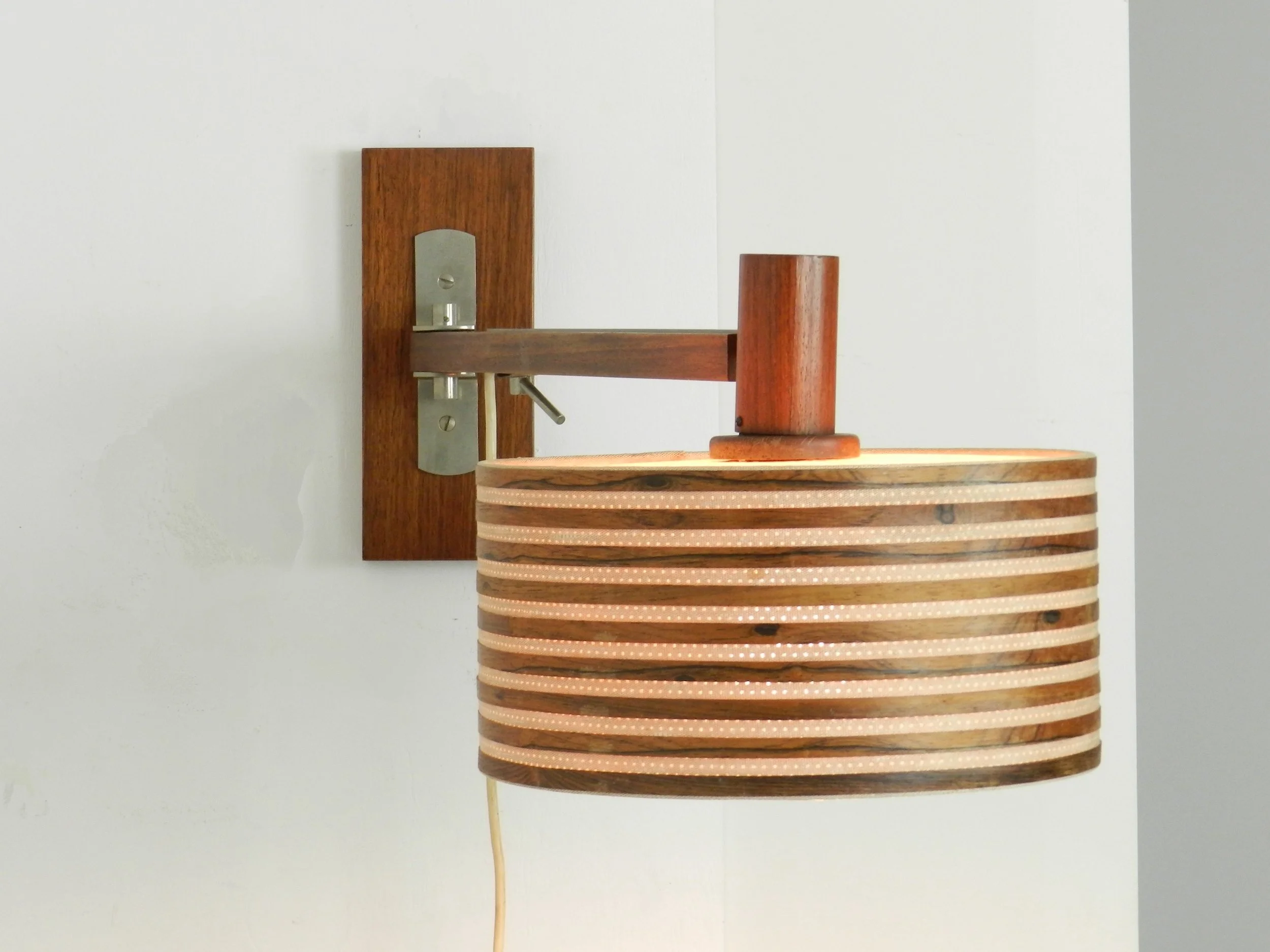 Mid century extendable wall lamp in rosewood and chrome with original shade.  Denmark, 1960s.