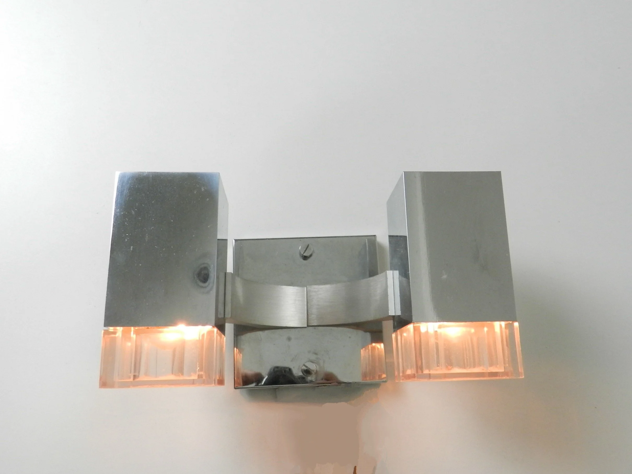 Pair of chrome and acrylic Cubic wall sconces designed by Gaetano Sciolari for Sciolari.  Italy, 1970s.