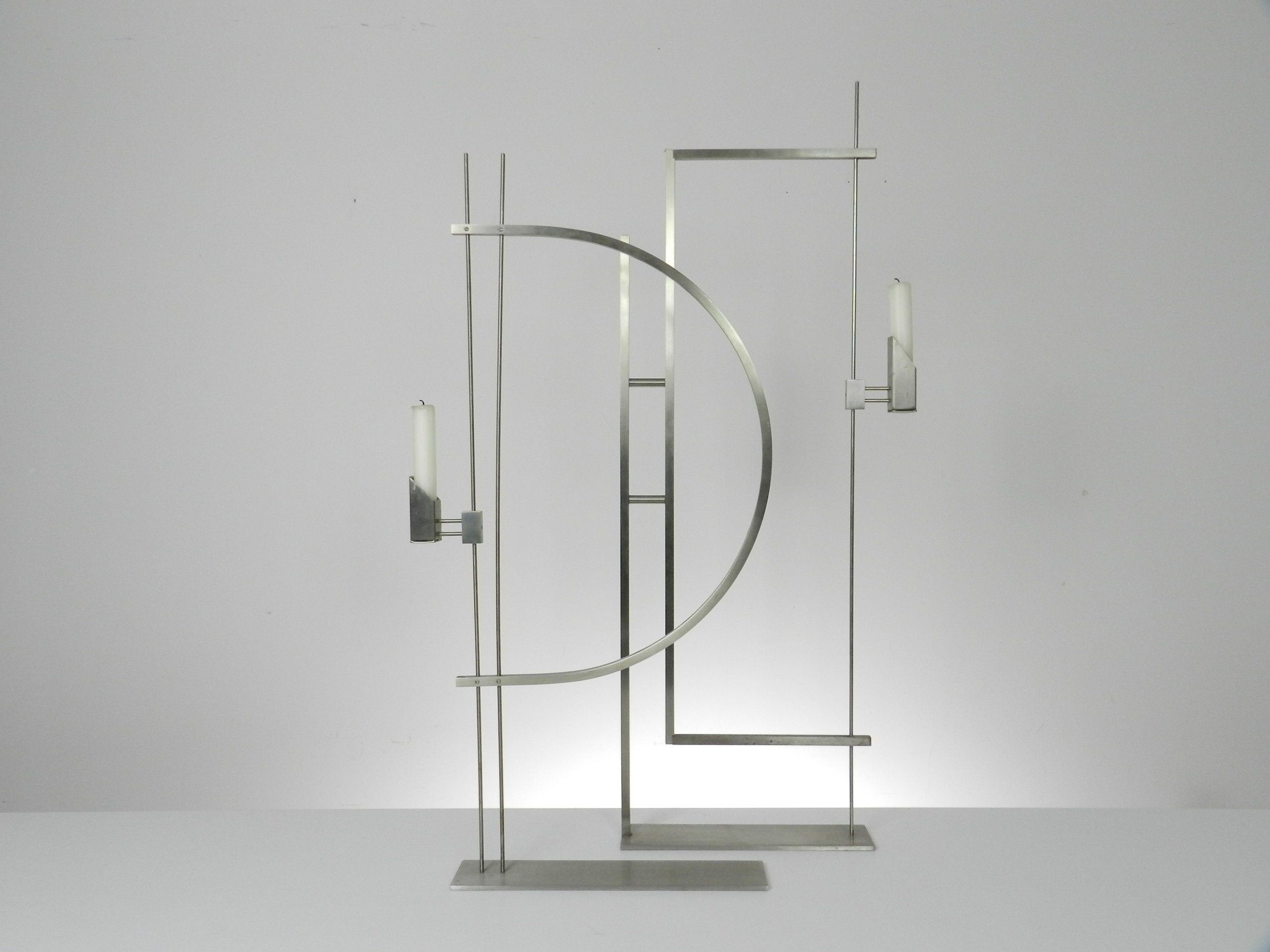 Pair of modernist stainless steel candle holders designed by David Zelman for Prologue 2000.  USA, 1980s.
