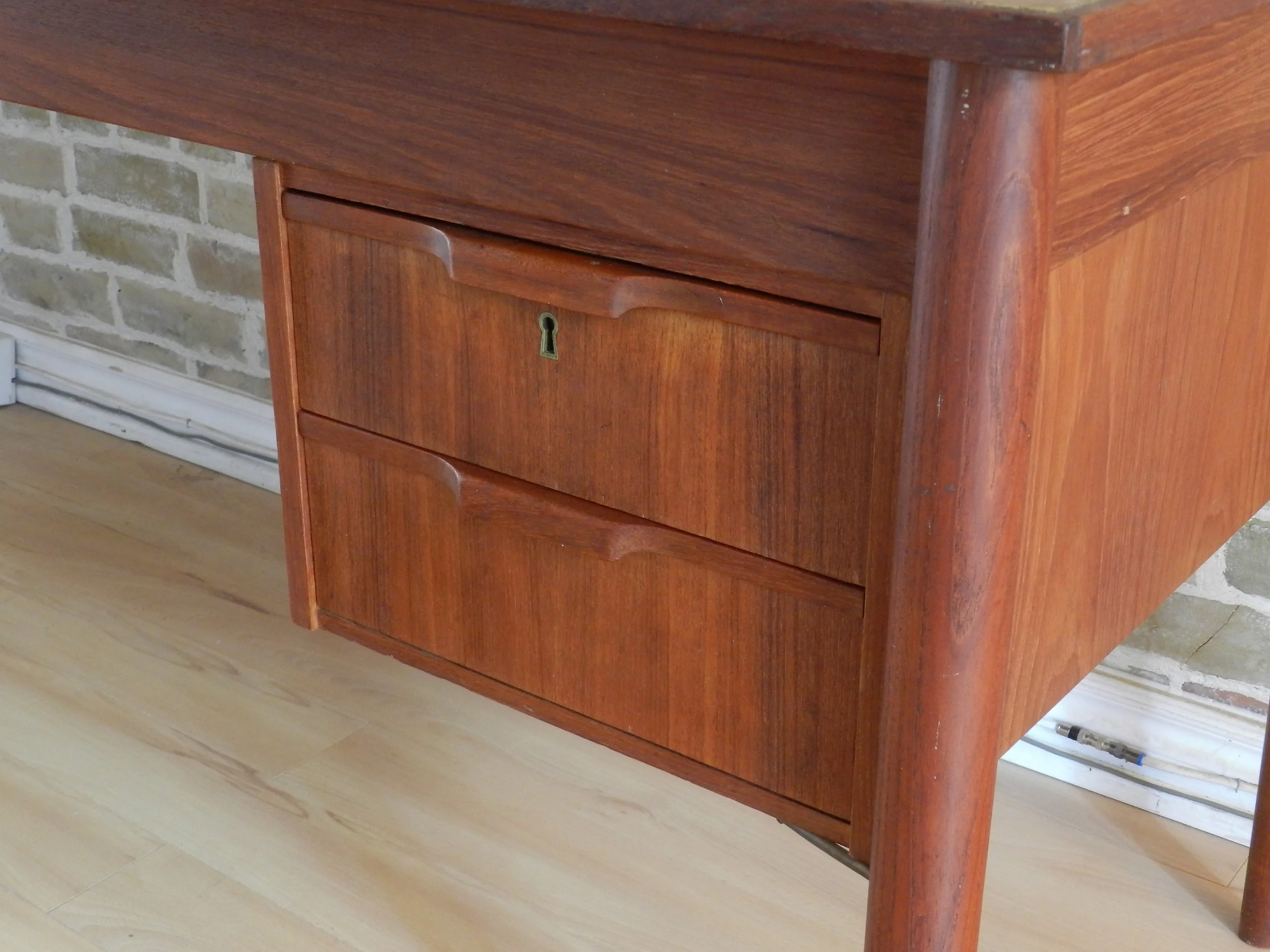 Compact teak desk with two drawers.  Denmark, 1960s.