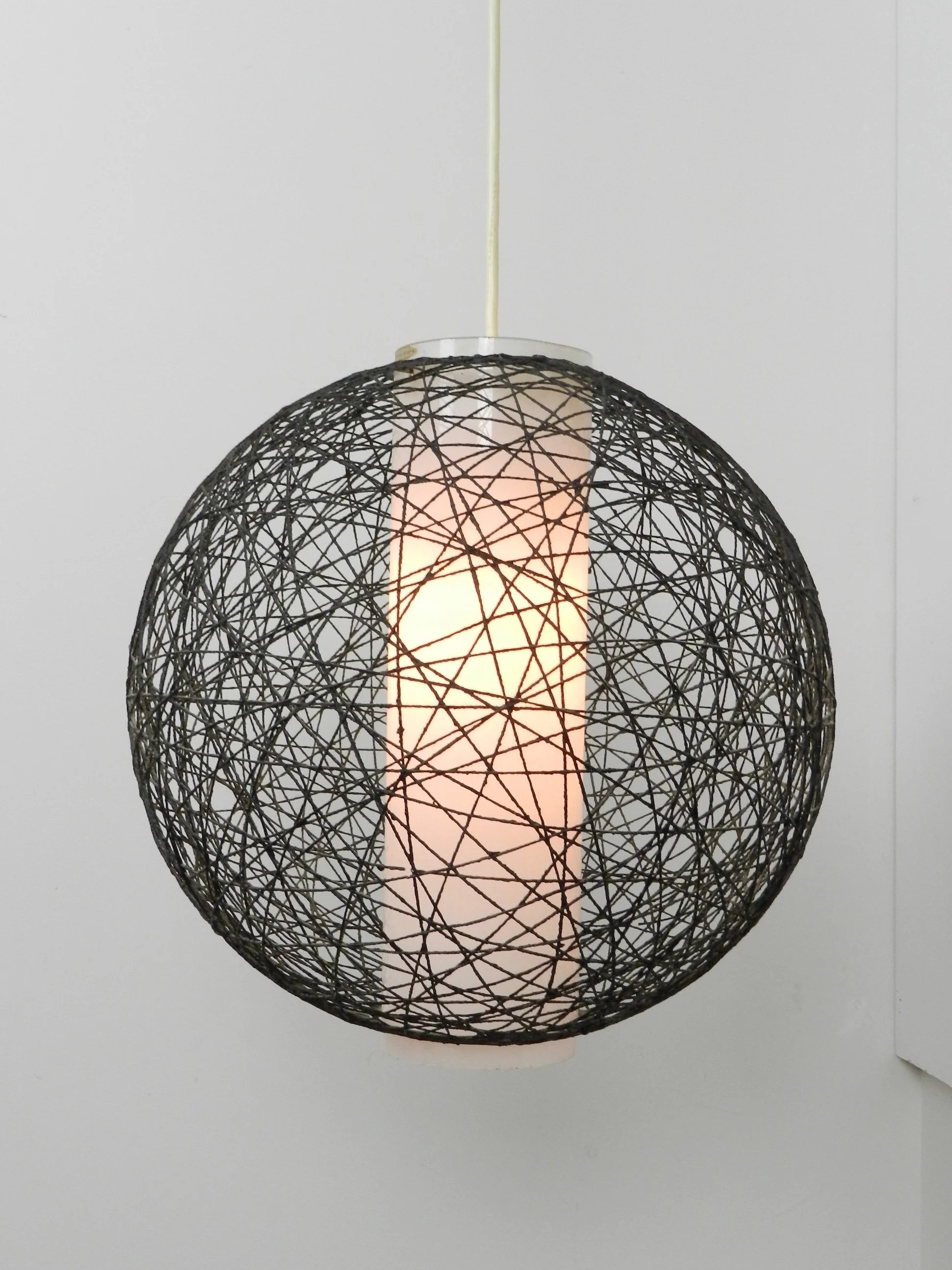 Scandinavian mid century wall lamp in teak with glass and string shade.  Finland, 1960s.
