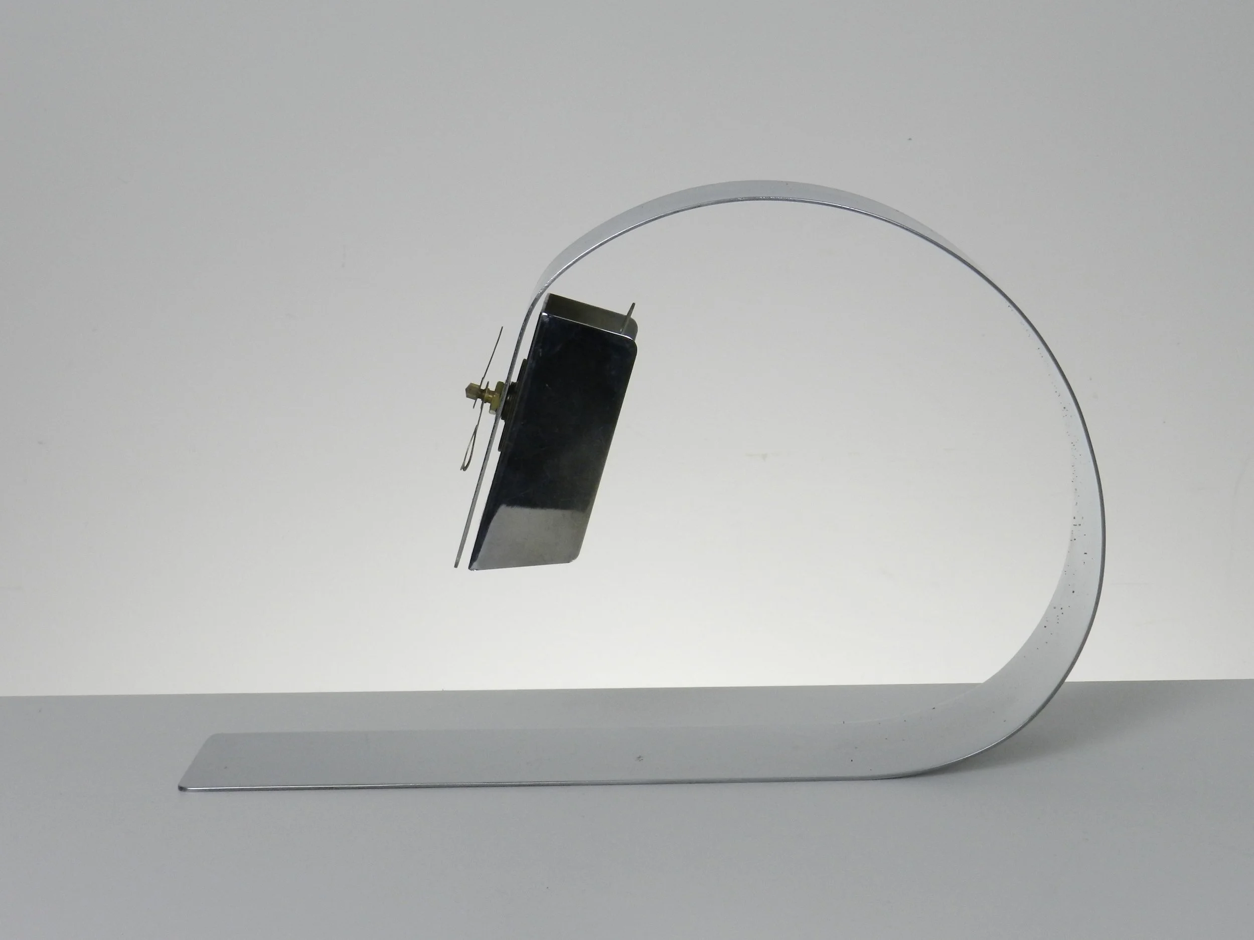 Space age desk clock in chromed steel.  England, 1970s.