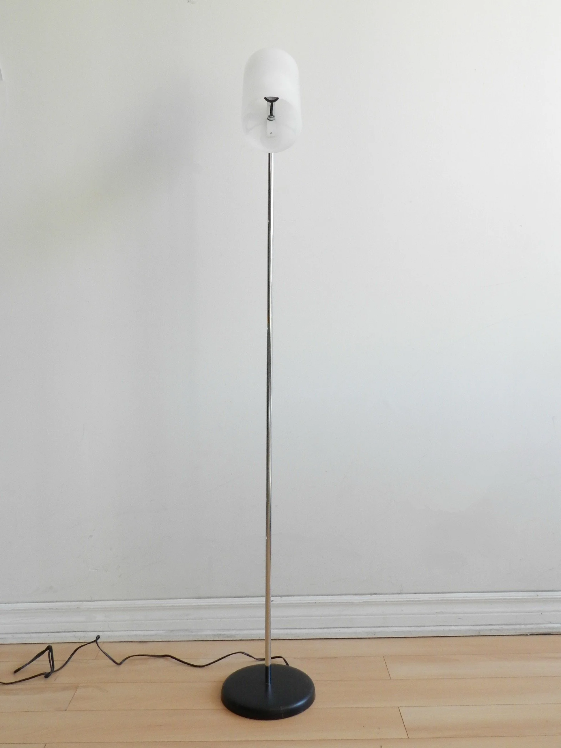 Floor lamp in chrome with acrylic shade by George Kovacs.  USA, 1970s.