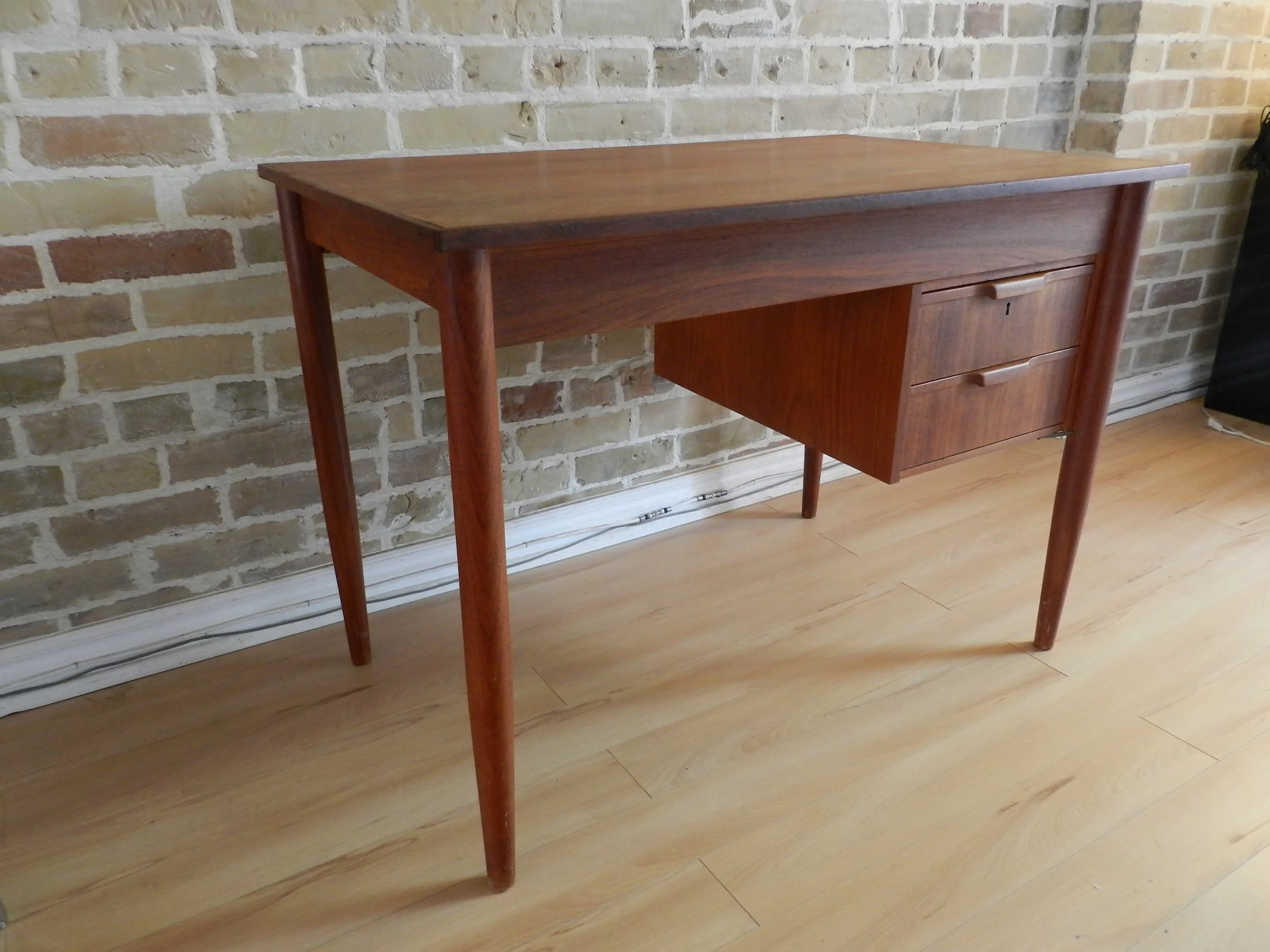 Compact teak desk with two drawers.  Denmark, 1960s.