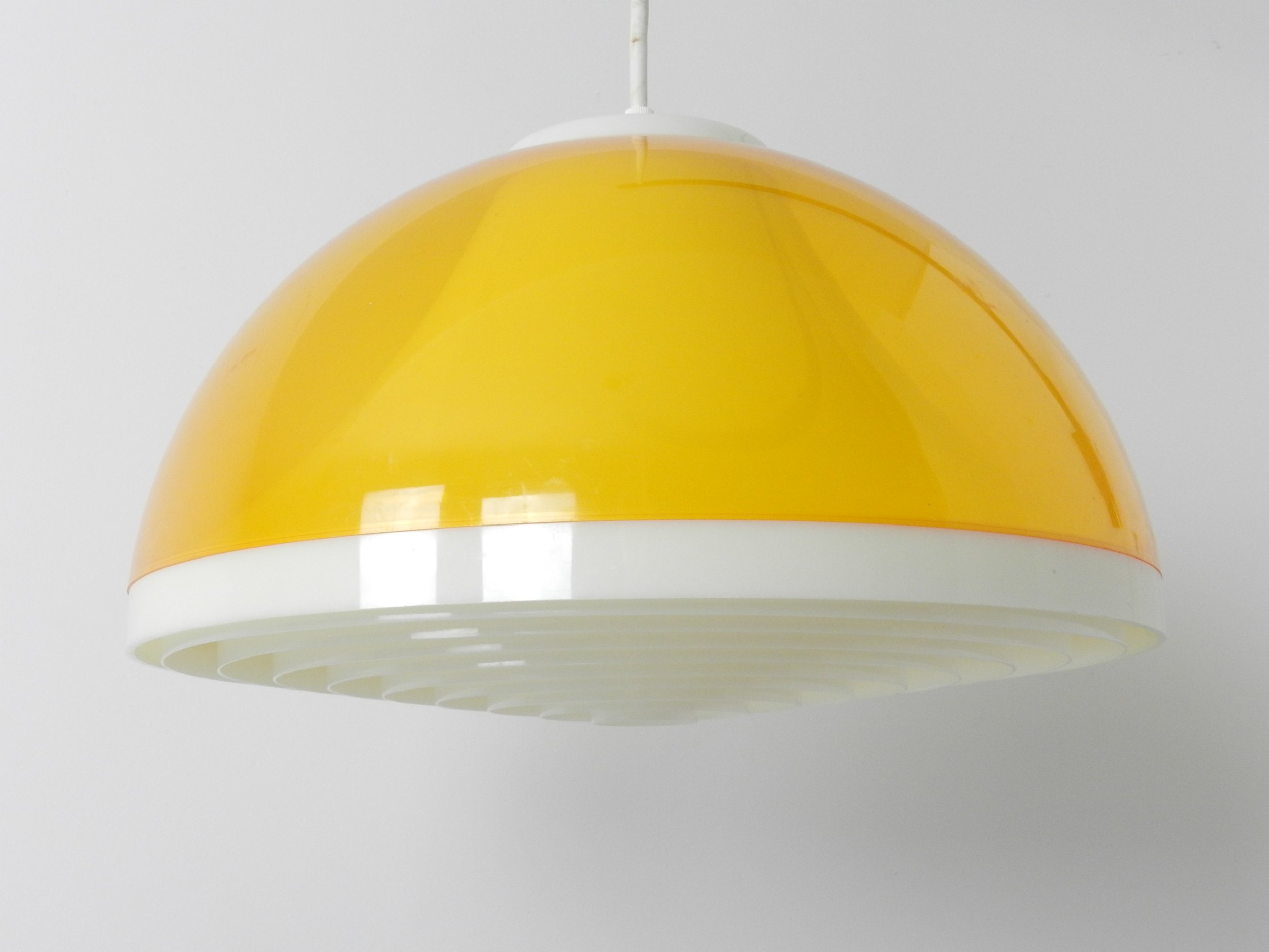 Mid century wall lamp with plastic shade and teak pivoting bracket.  Scandinavia, 1960s.