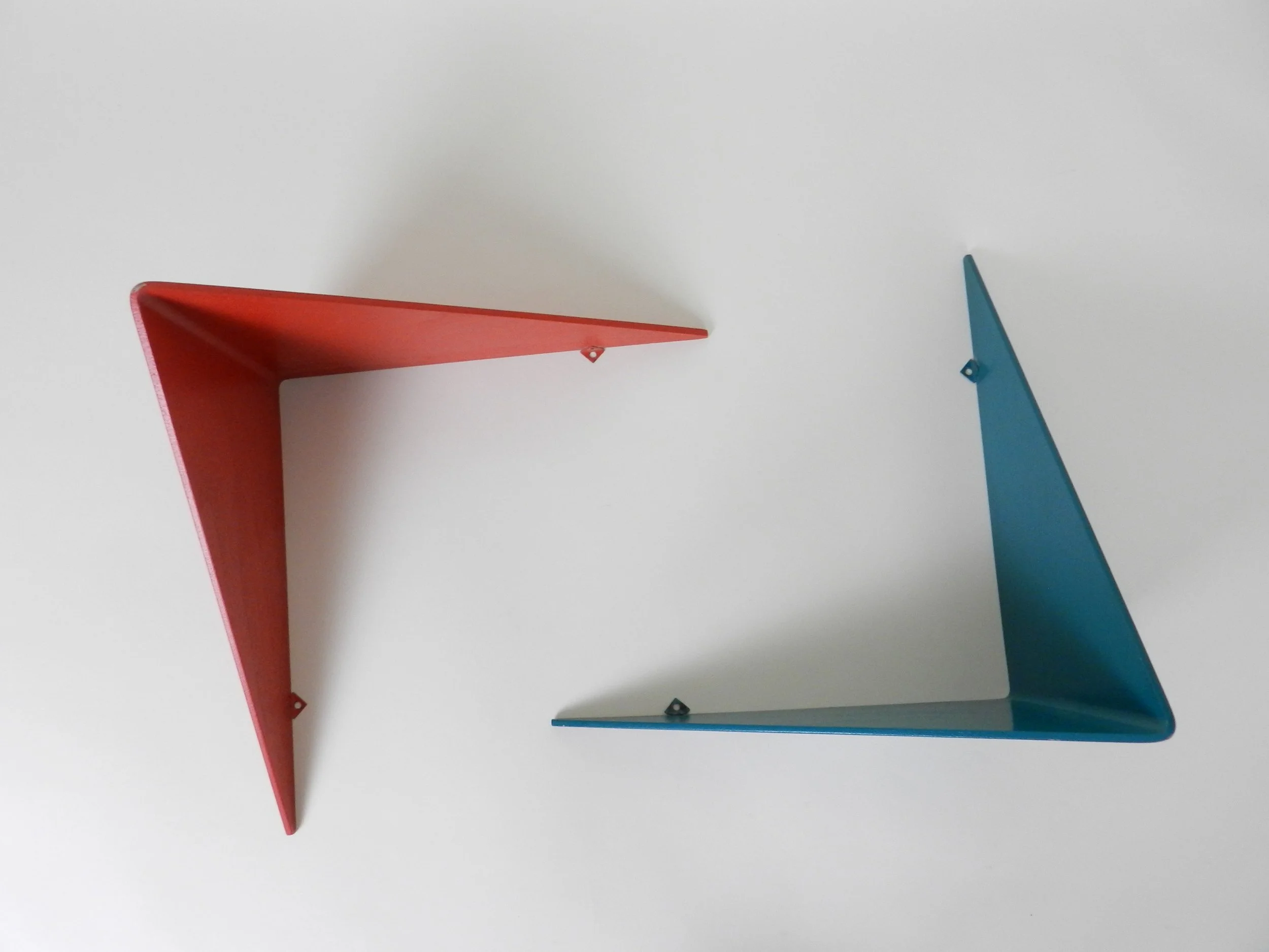 Pair of wall shelves in painted bent plywood, designed by Poul Cadovius.  Denmark, 1960s.