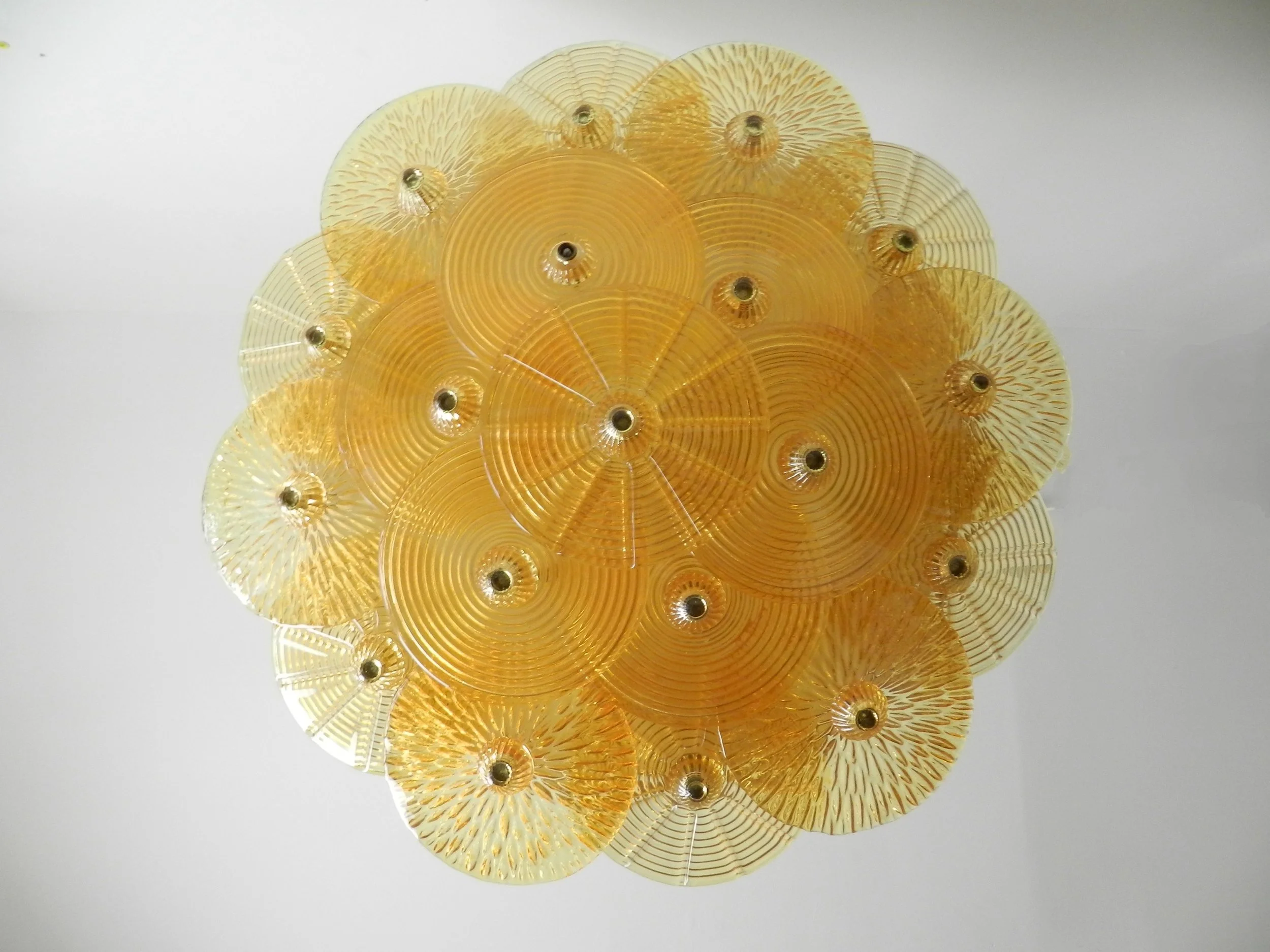 Large murano amber glass disc chandlier from Italy.