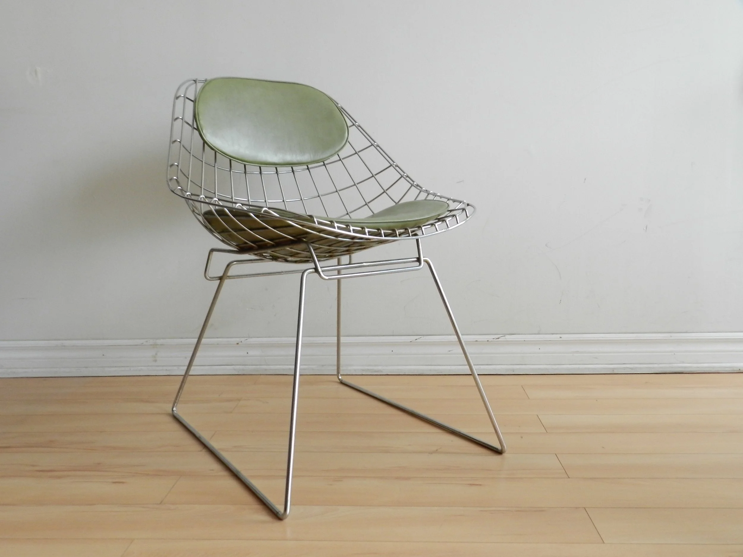 Pair of sculptural side chairs in chromed steel wire designed by Cees Braakman for Pastoe.  Netherlands, 1960s.