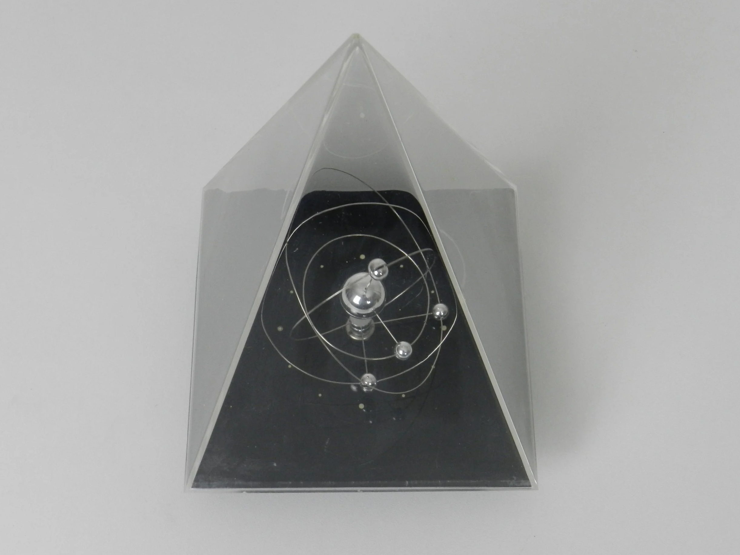 Space age planetary orbit clock in clear and black acrylic with chrome wires.  circa 1980s.